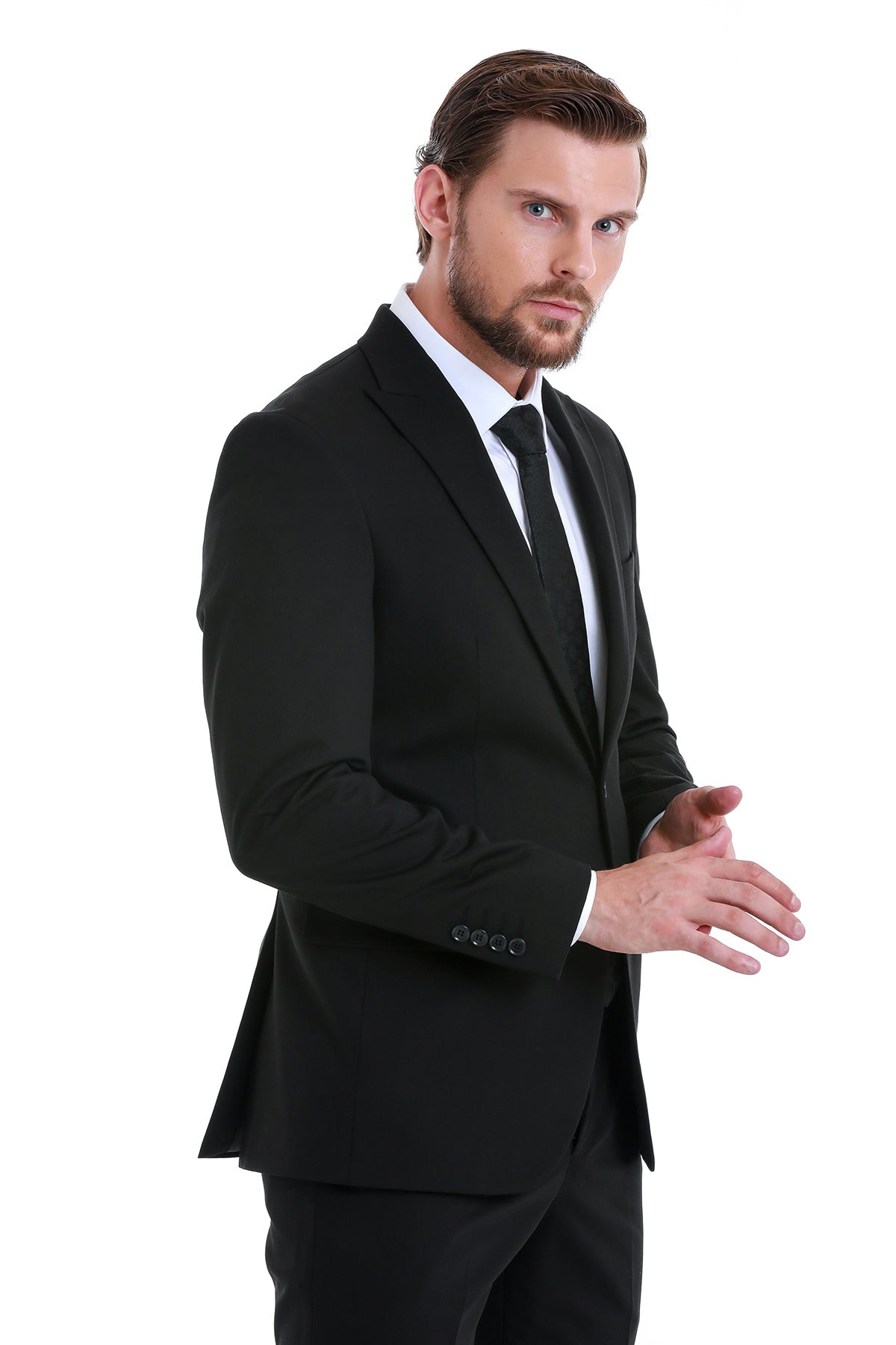 Slim fit black peak lapel two-piece classic suit featuring a tailored modern cut with matching slim fit black trousers