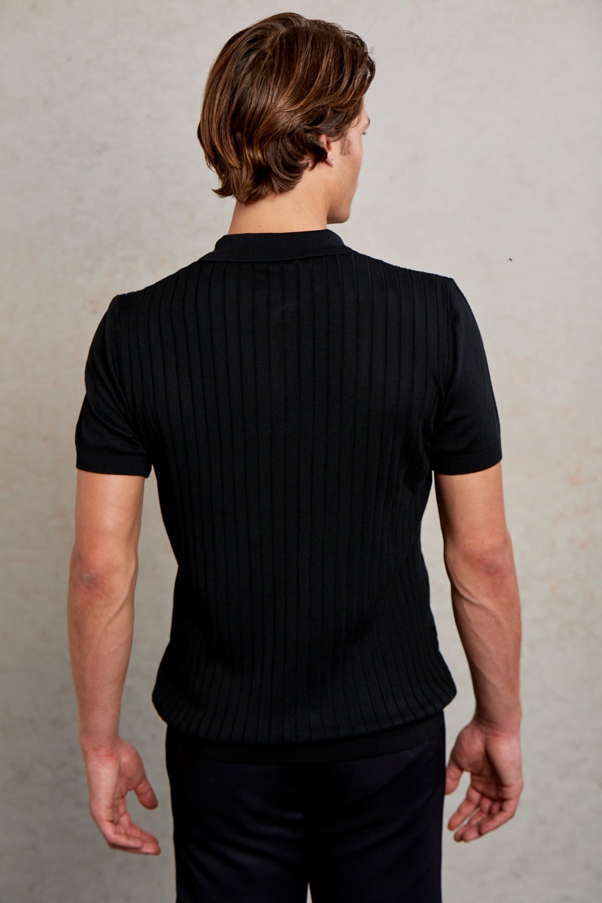 Black ribbed knit short-sleeve polo shirt.