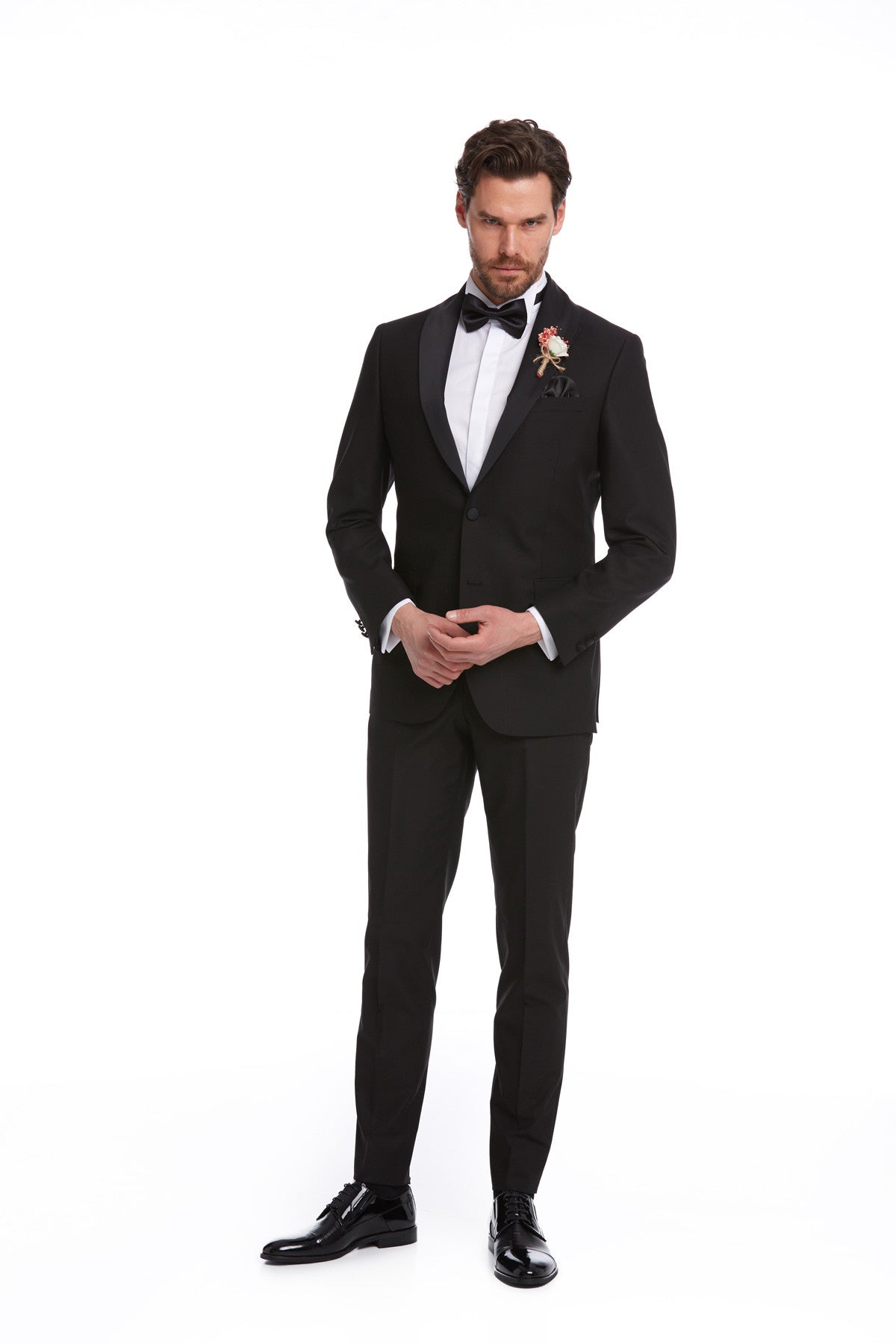 Black tuxedo suit with satin lapels and a matching bow tie.