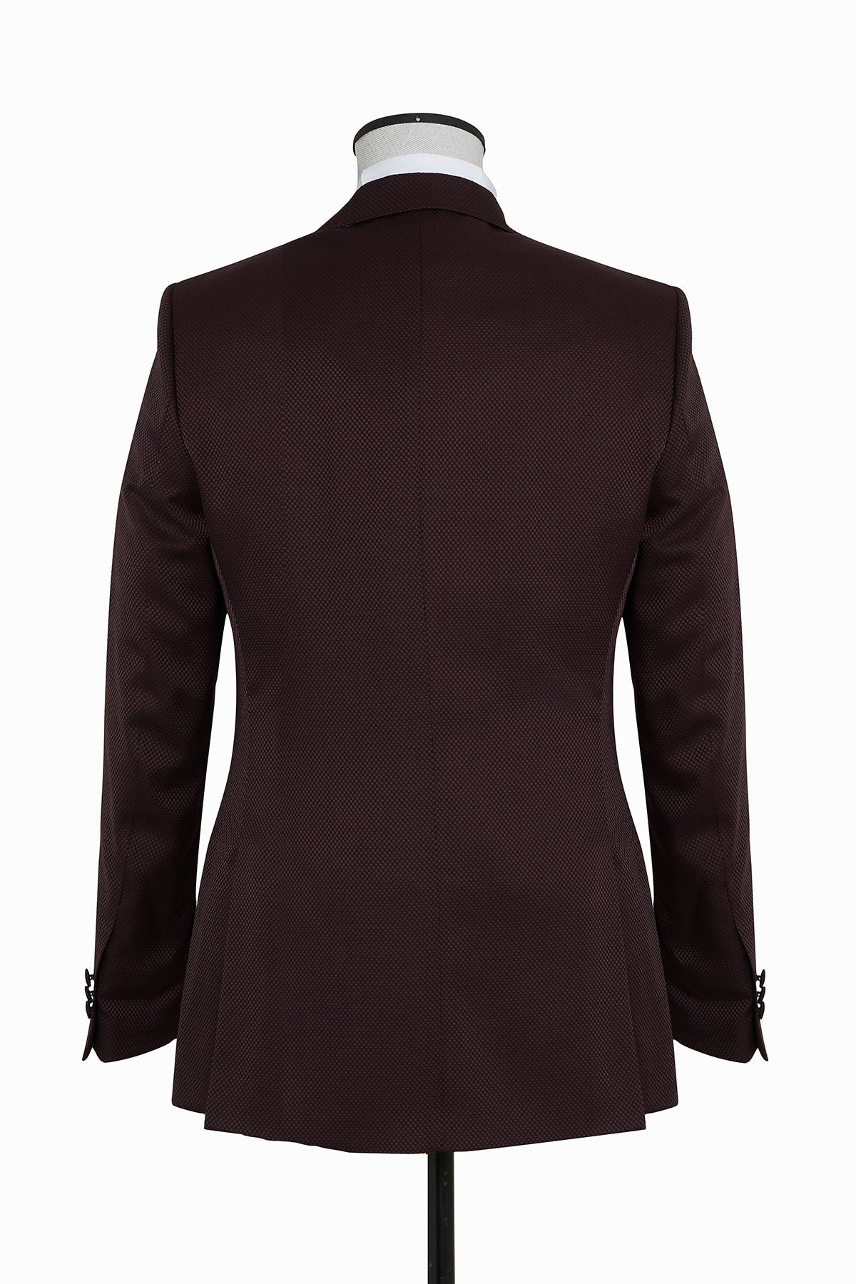 A tailored dark burgundy suit jacket with a subtle textured pattern and black buttoned cuffs.