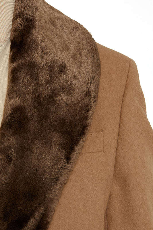 A camel-colored wool coat with a plush, dark brown fur collar.