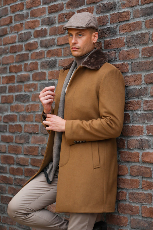 A tan wool overcoat with a dark brown fur-lined collar and matching buttons.