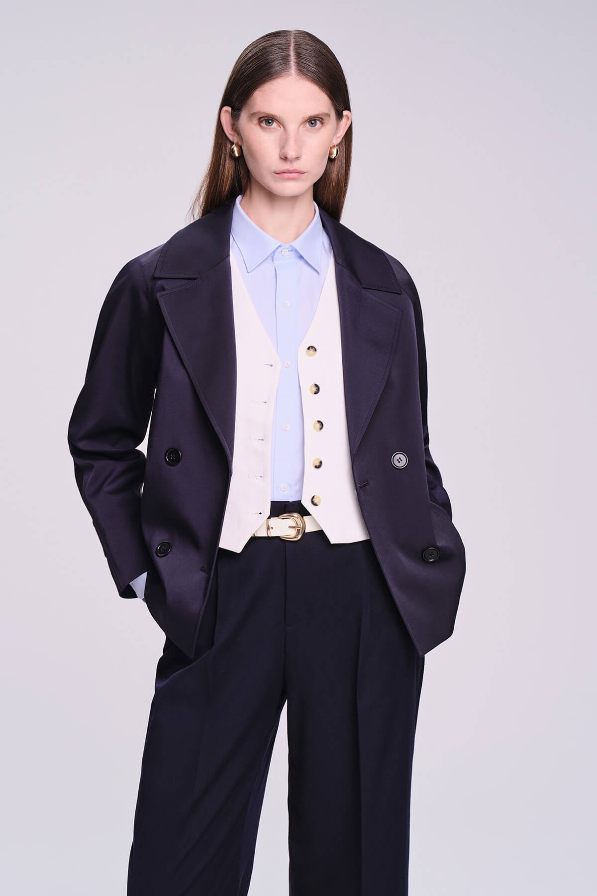 Navy blue double-breasted blazer with satin lapels and gold-toned buttons