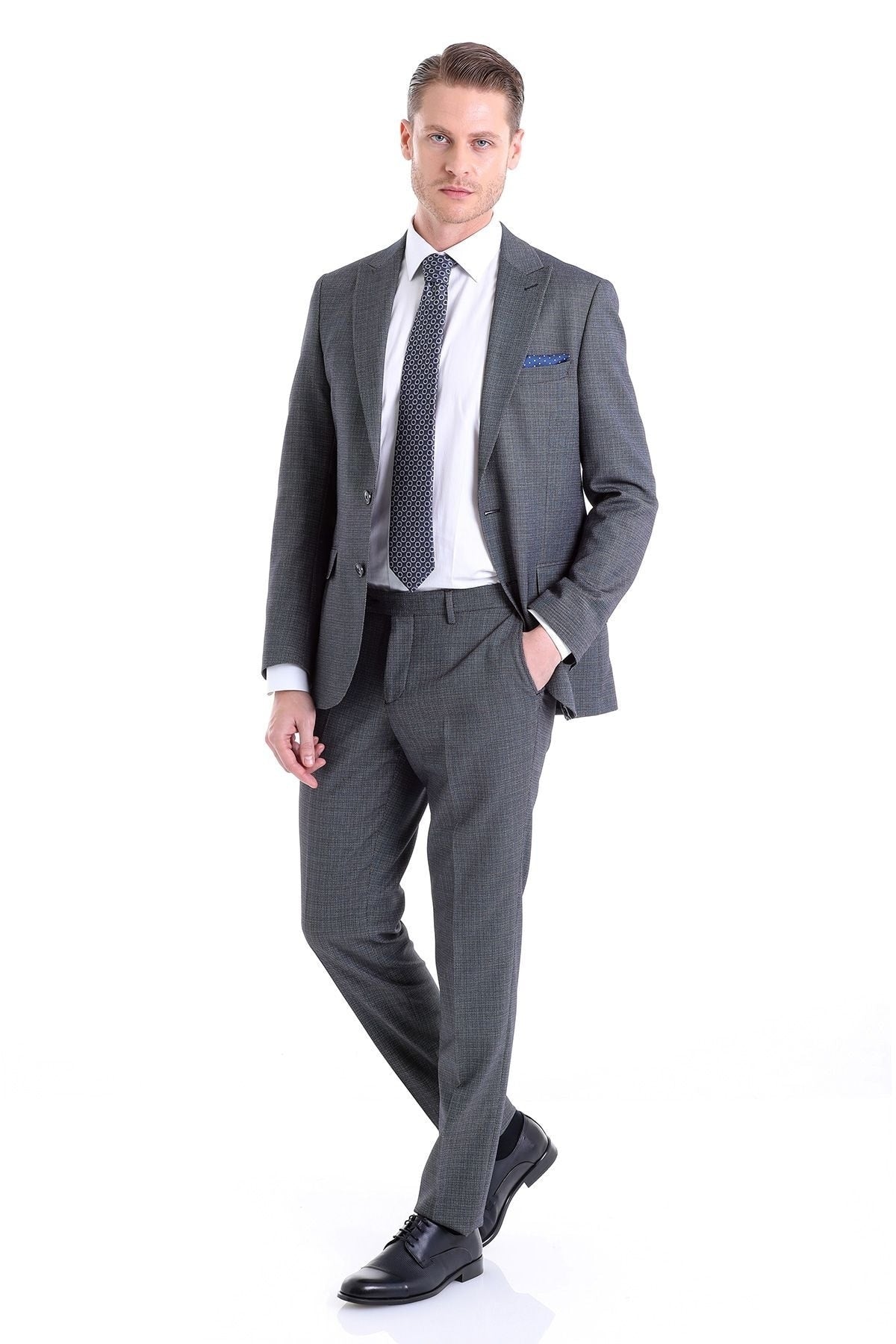 Gray checkered men’s suit with a matching pair of trousers.