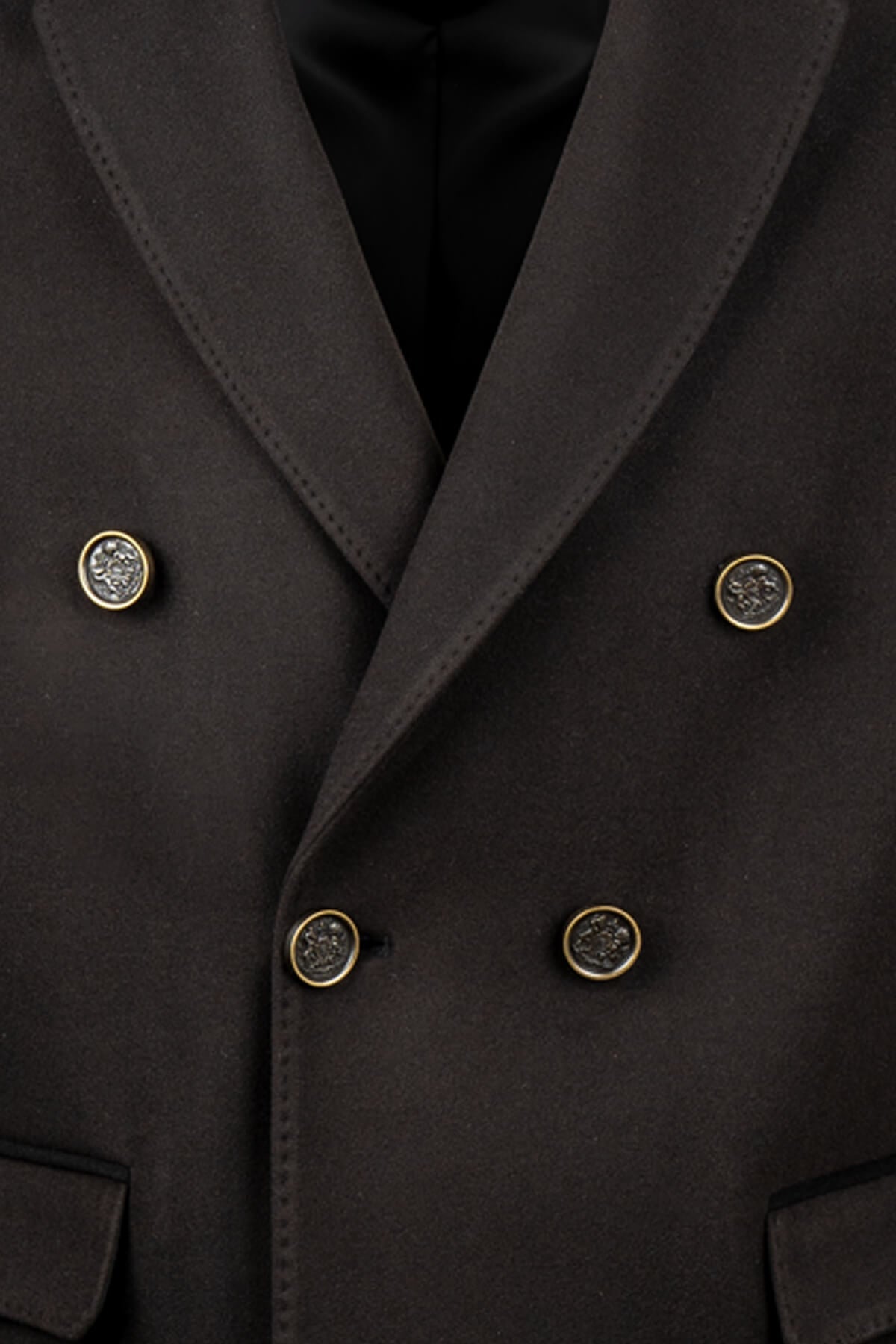 Black double-breasted coat with gold-toned, ornate buttons.