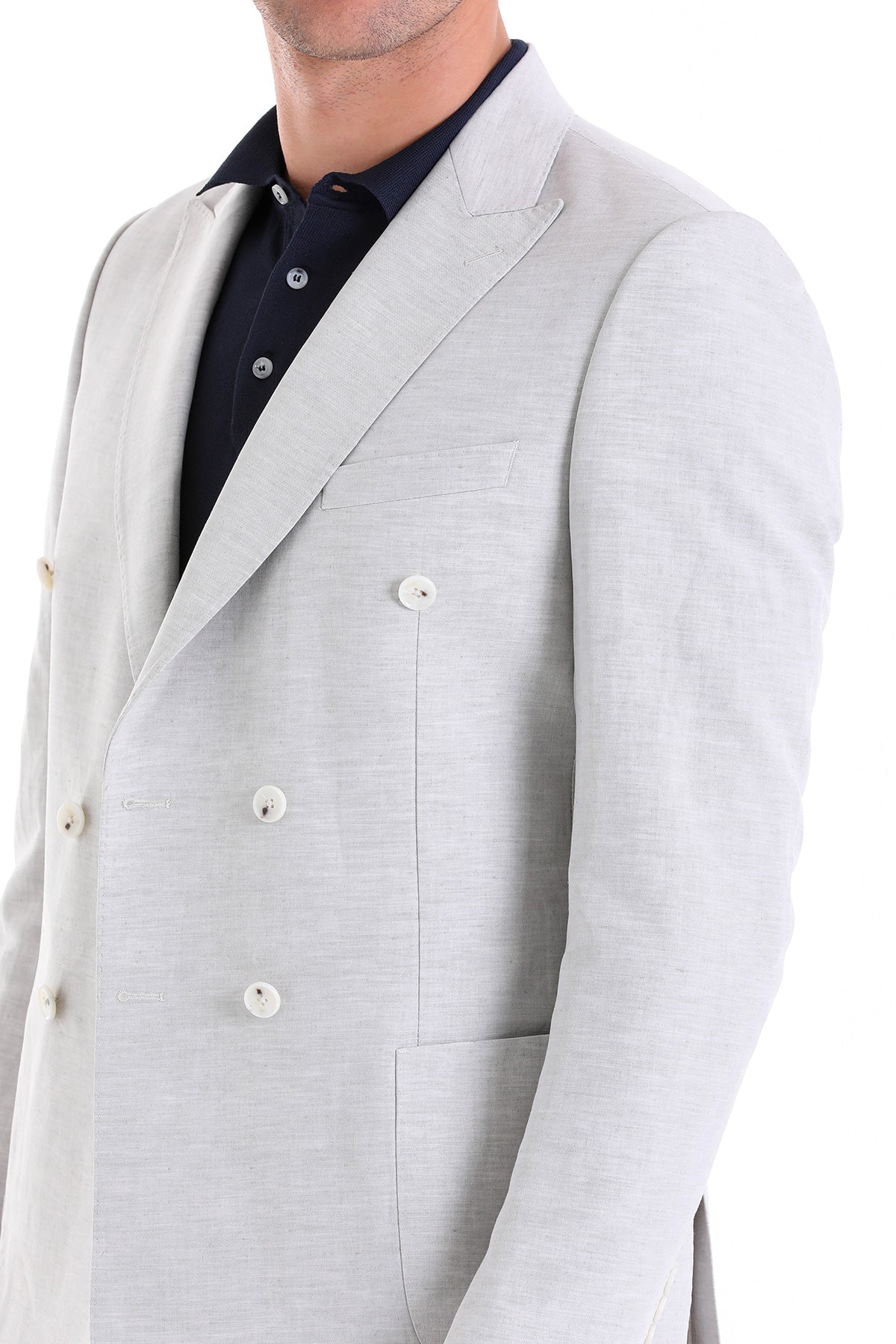 Light gray double-breasted blazer with subtle texture and white buttons.