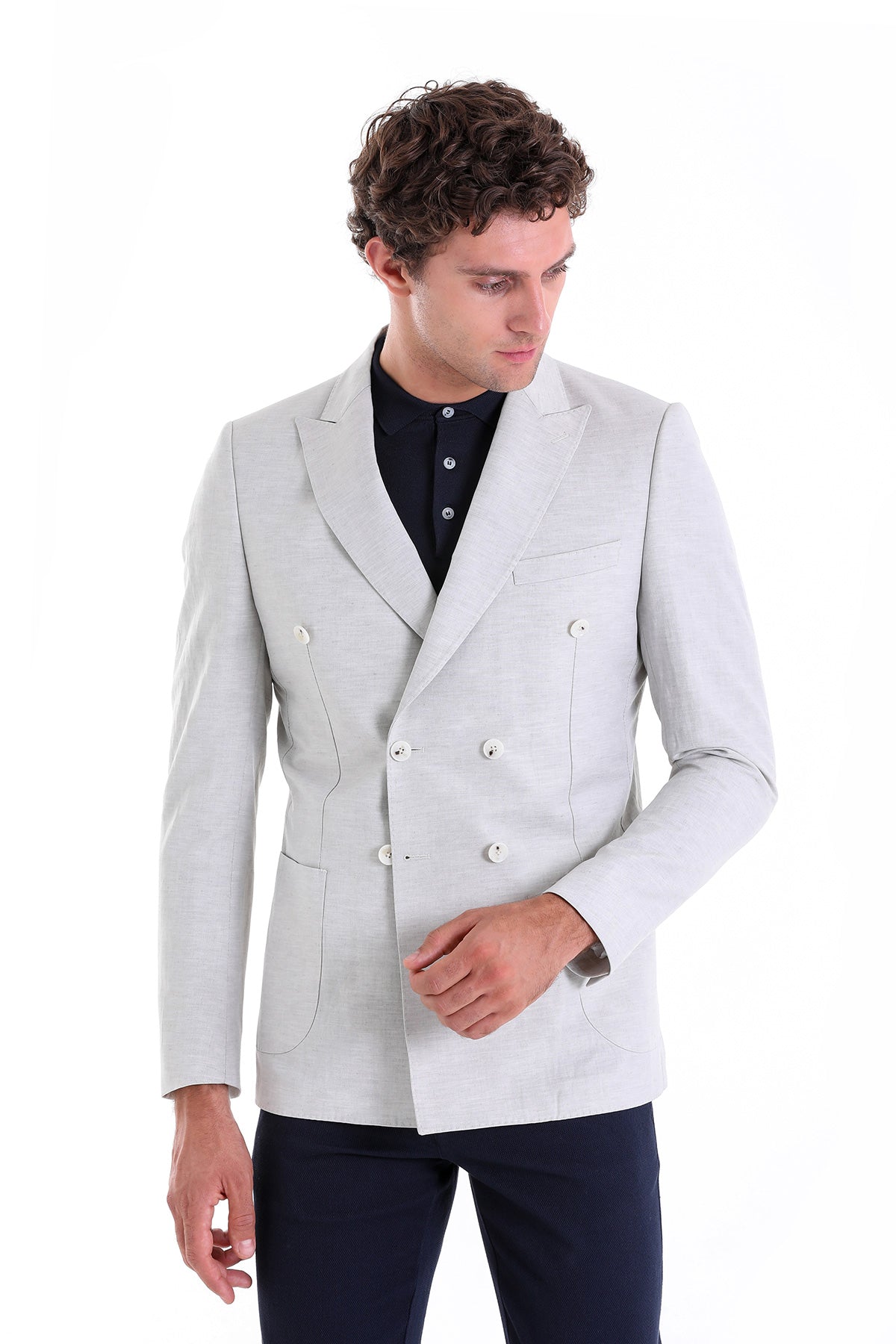 A sleek, light gray double-breasted blazer with white buttons and a tailored fit.
