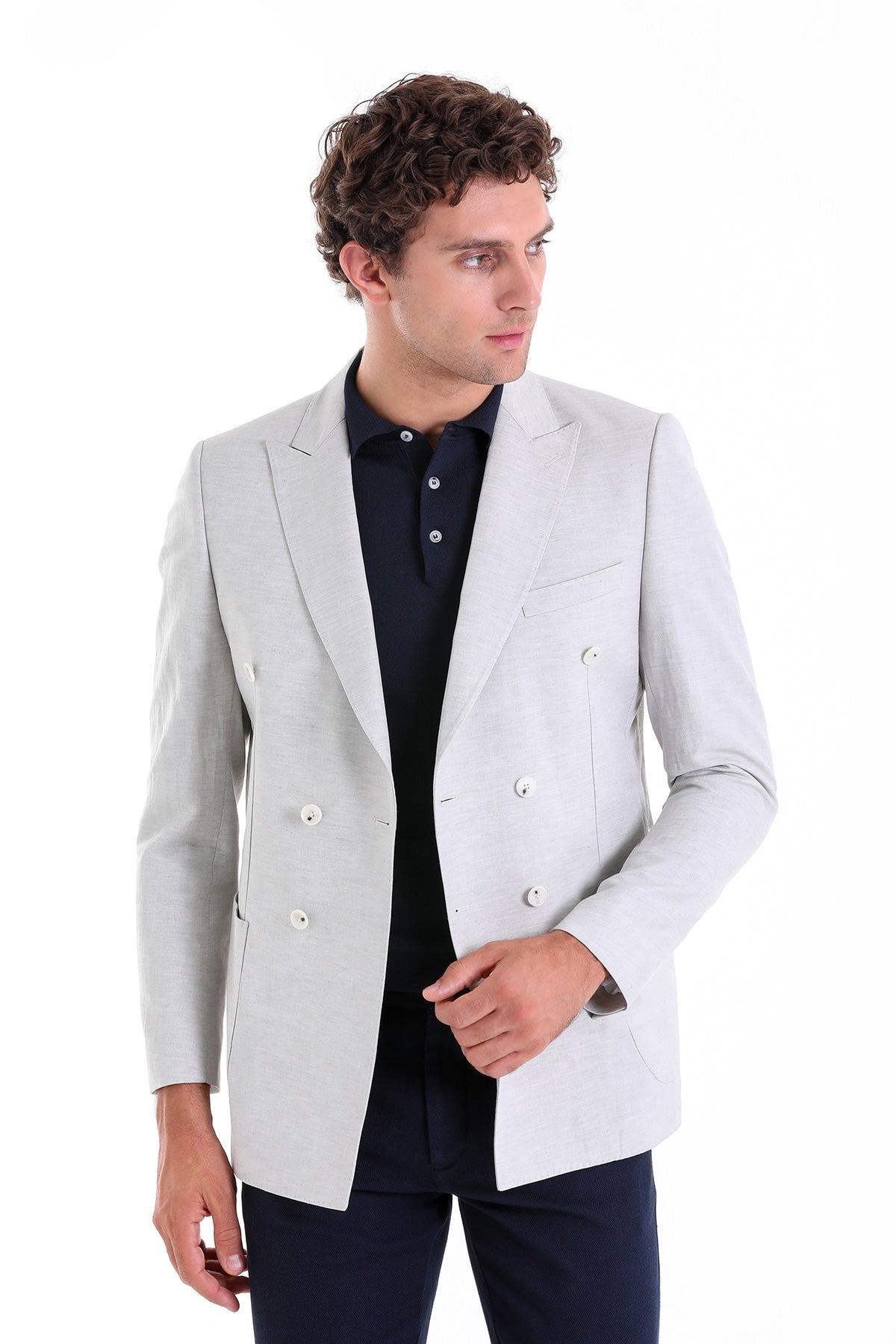 Light gray double-breasted blazer with white buttons and a tailored fit.