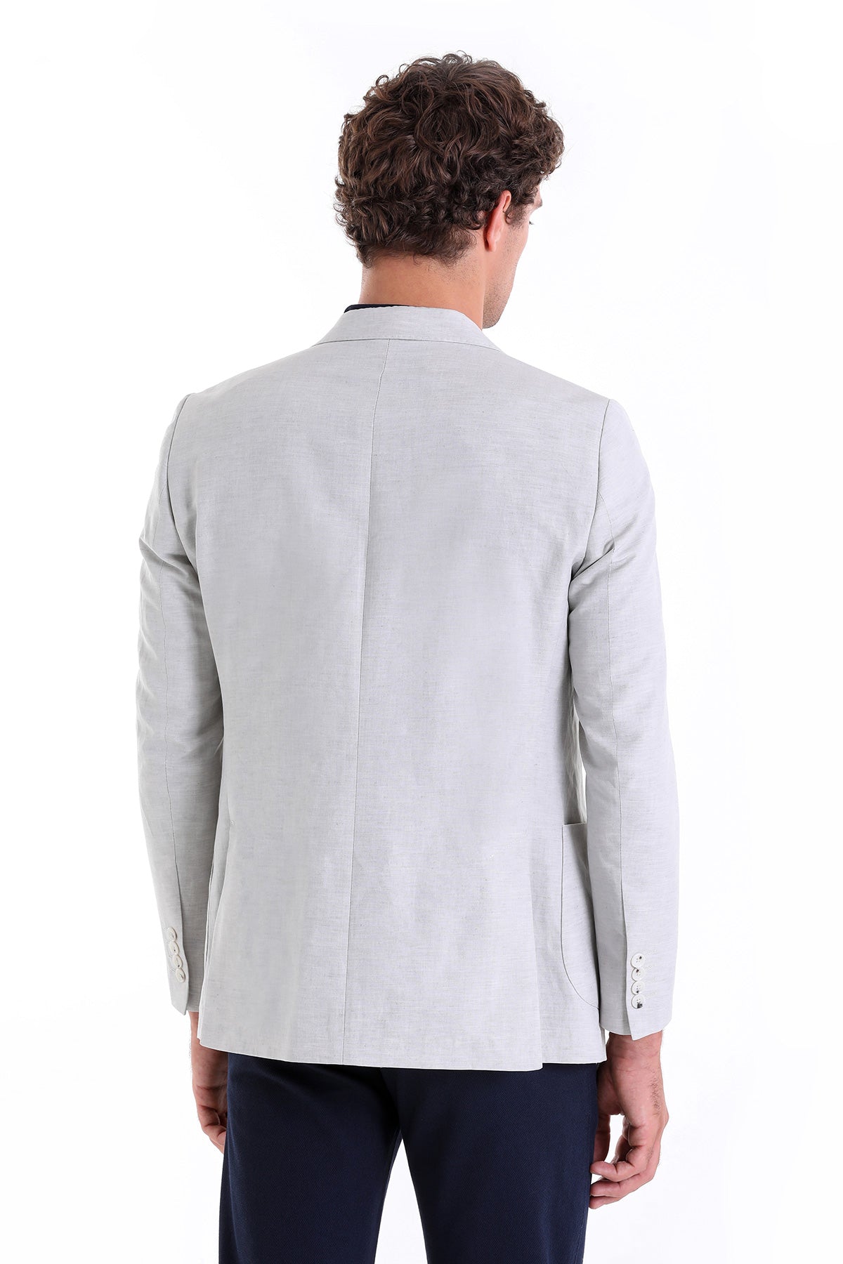 Light gray tailored blazer with subtle texture and structured shoulders