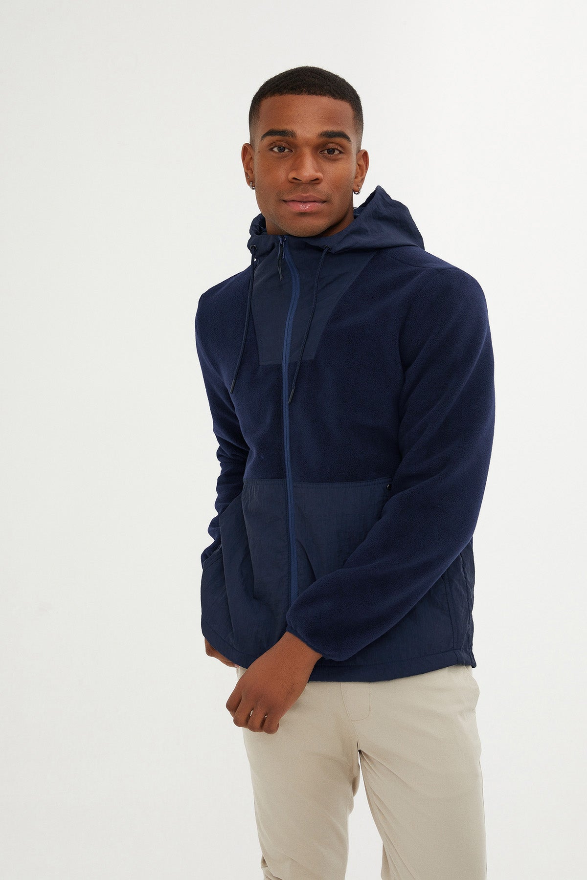 Navy blue hooded jacket with a subtle color-block design and full-zip front