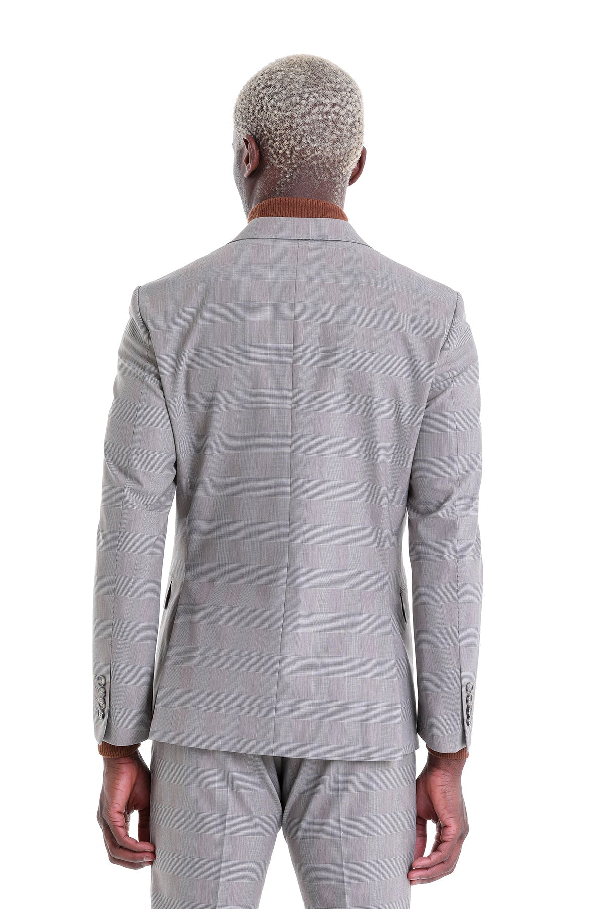 Gray textured suit jacket with subtle pattern and structured shoulders.
