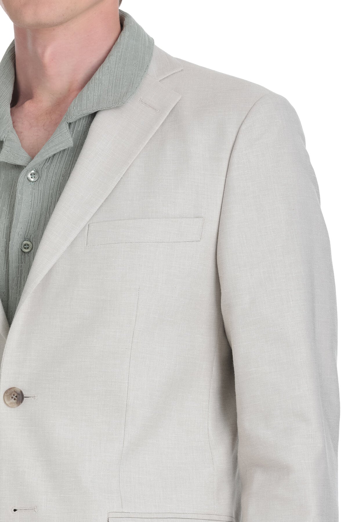 Light beige linen blazer with subtle texture and a single-breasted design.