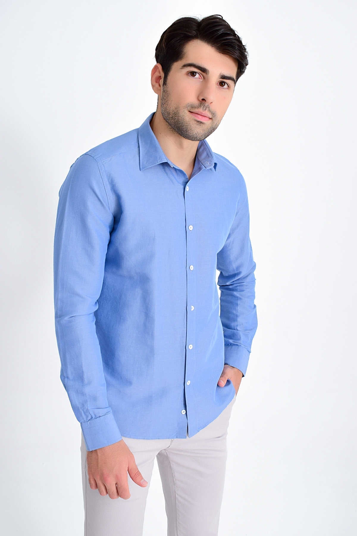 Light blue long-sleeved men’s dress shirt with a classic collar and button-down front.