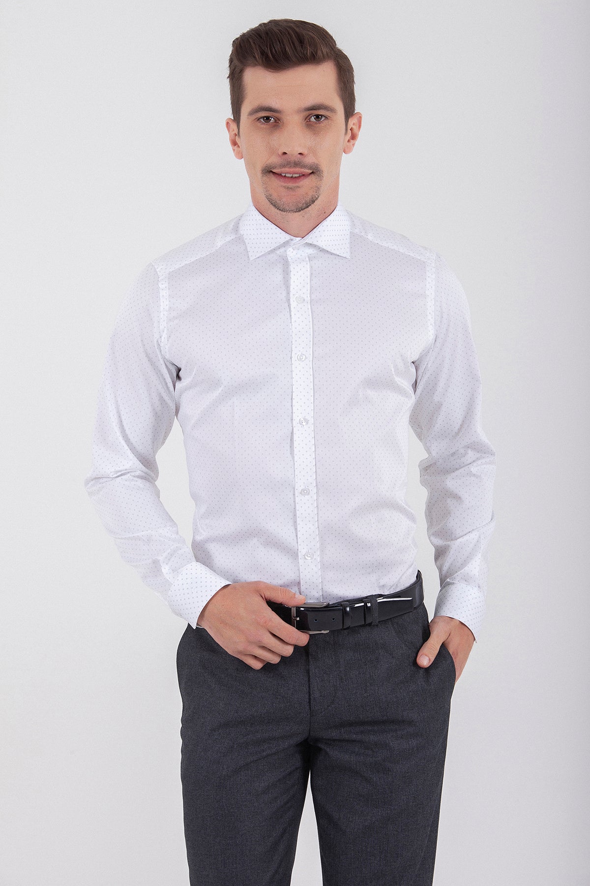 White long-sleeved dress shirt with a classic collar and button-down front.