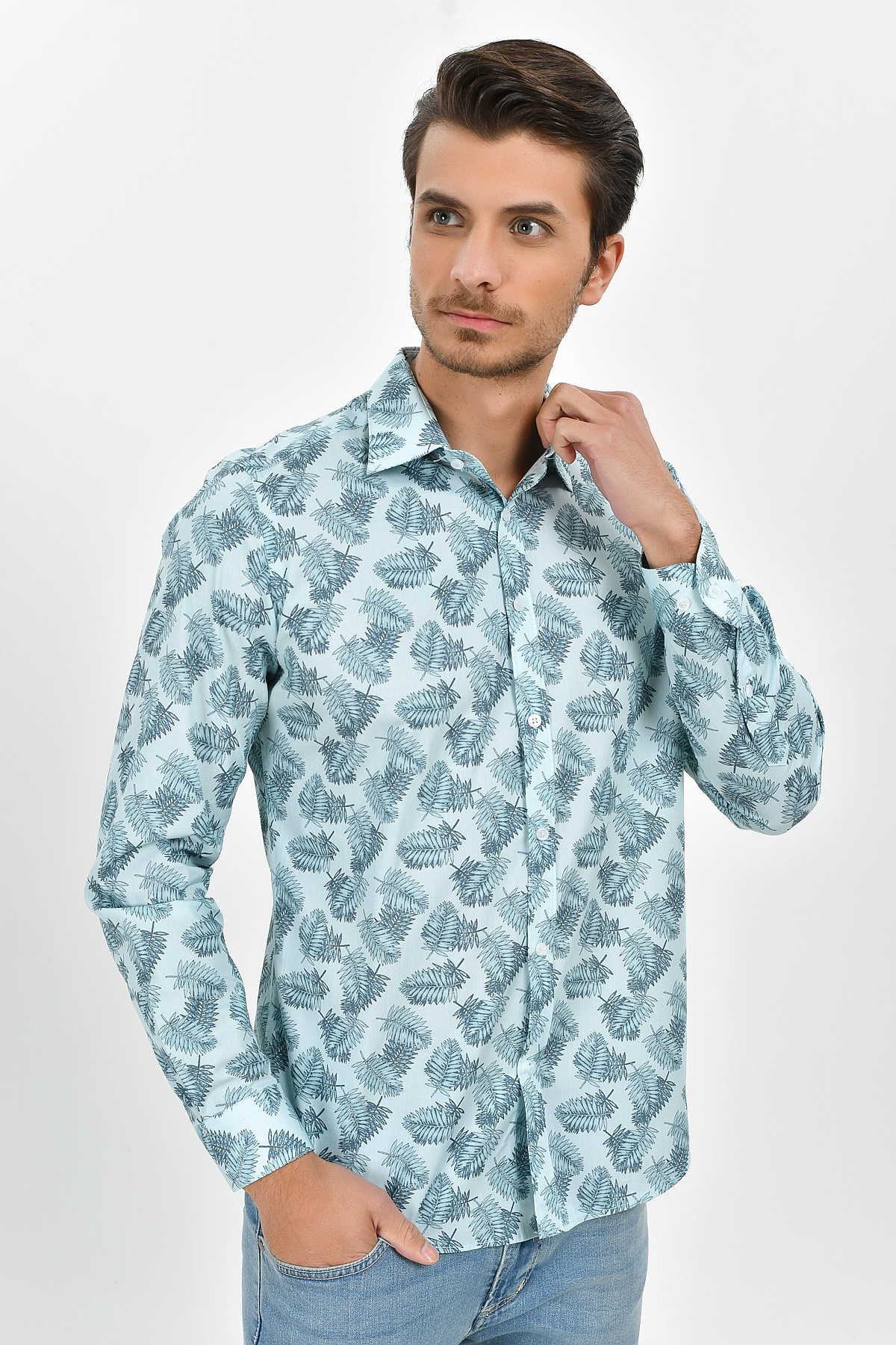 Light blue long-sleeved button-up shirt with a repeating dark green fern leaf pattern.