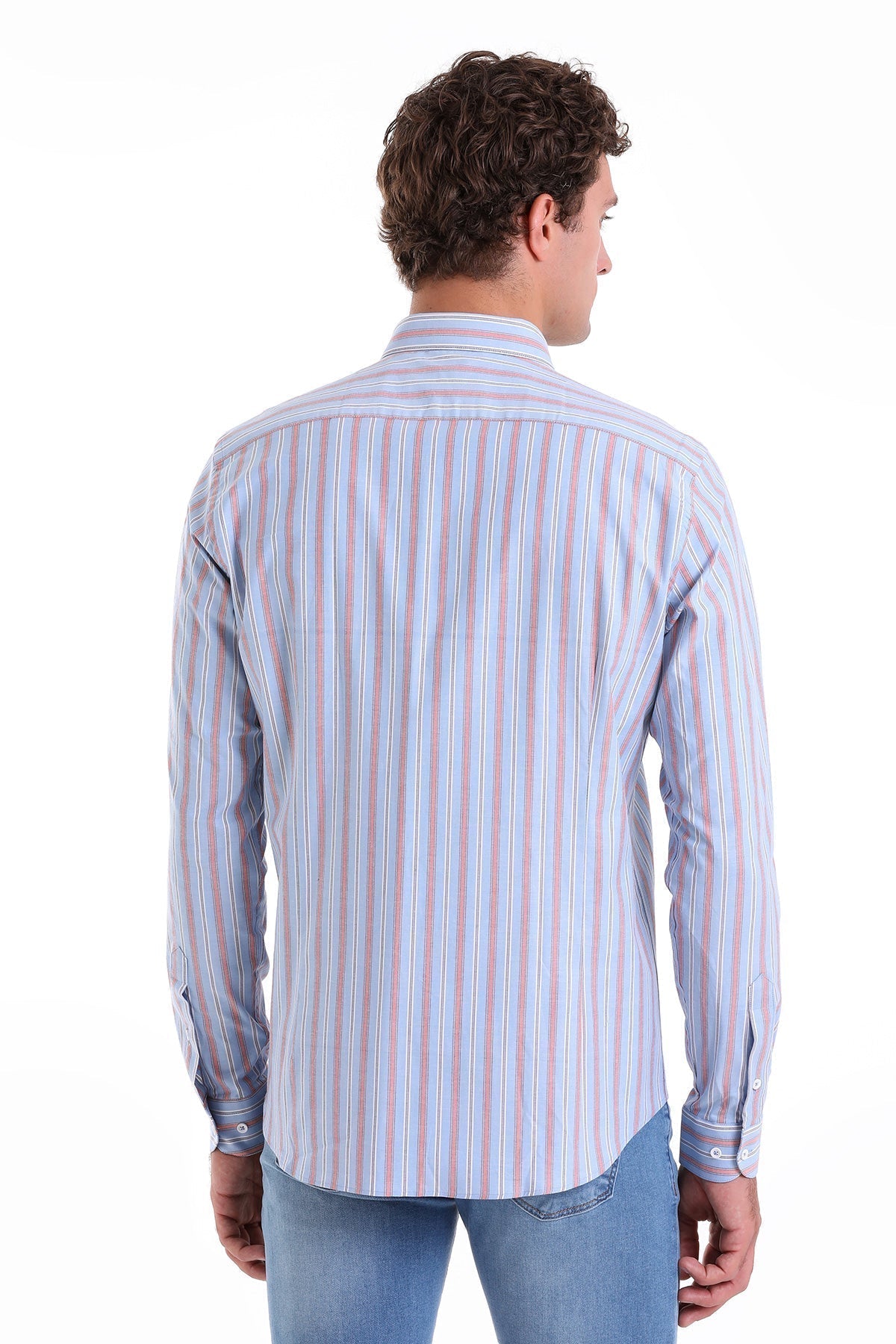 A man wearing a long-sleeved, button-down shirt with vertical stripes in soft blue, pink, and white.