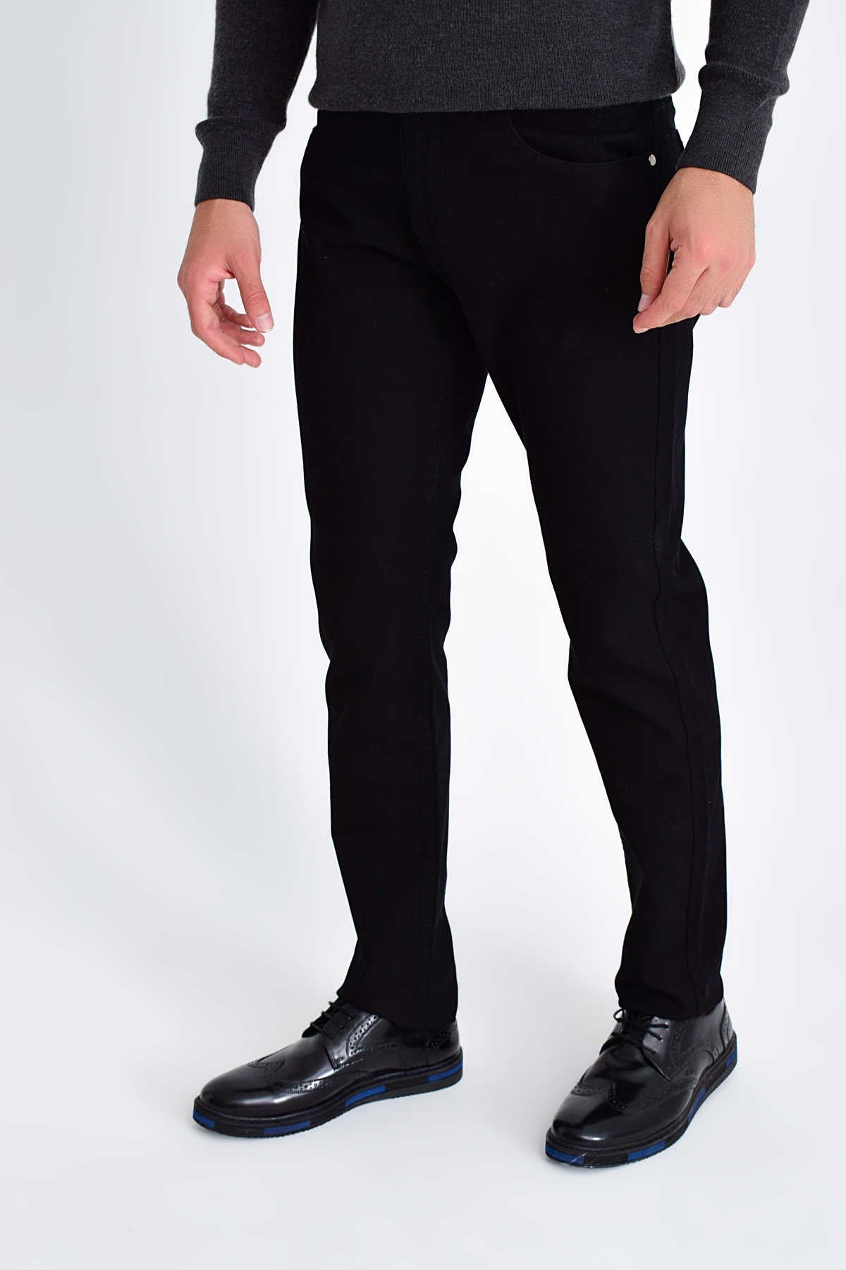 Black slim-fit trousers with a sleek, modern design and subtle stitching details.