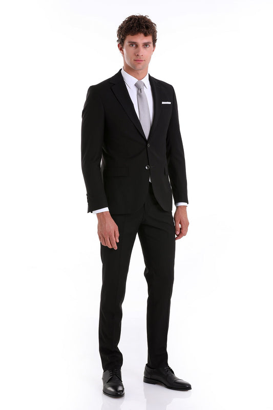 Black tailored suit with a sleek, modern cut and matching trousers.