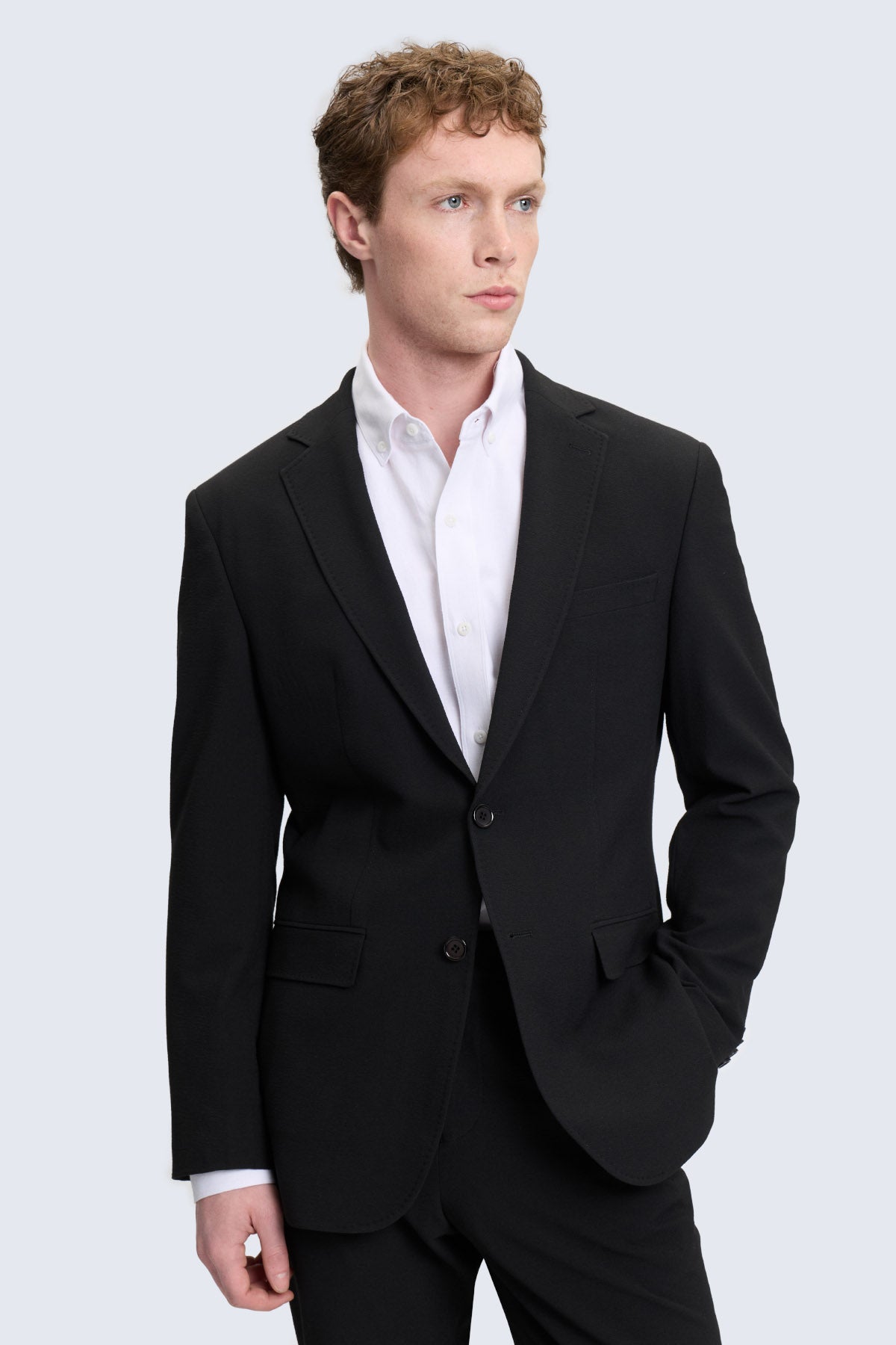Black slim fit tailored suit jacket with notch lapel and two front buttons for smart casual wear