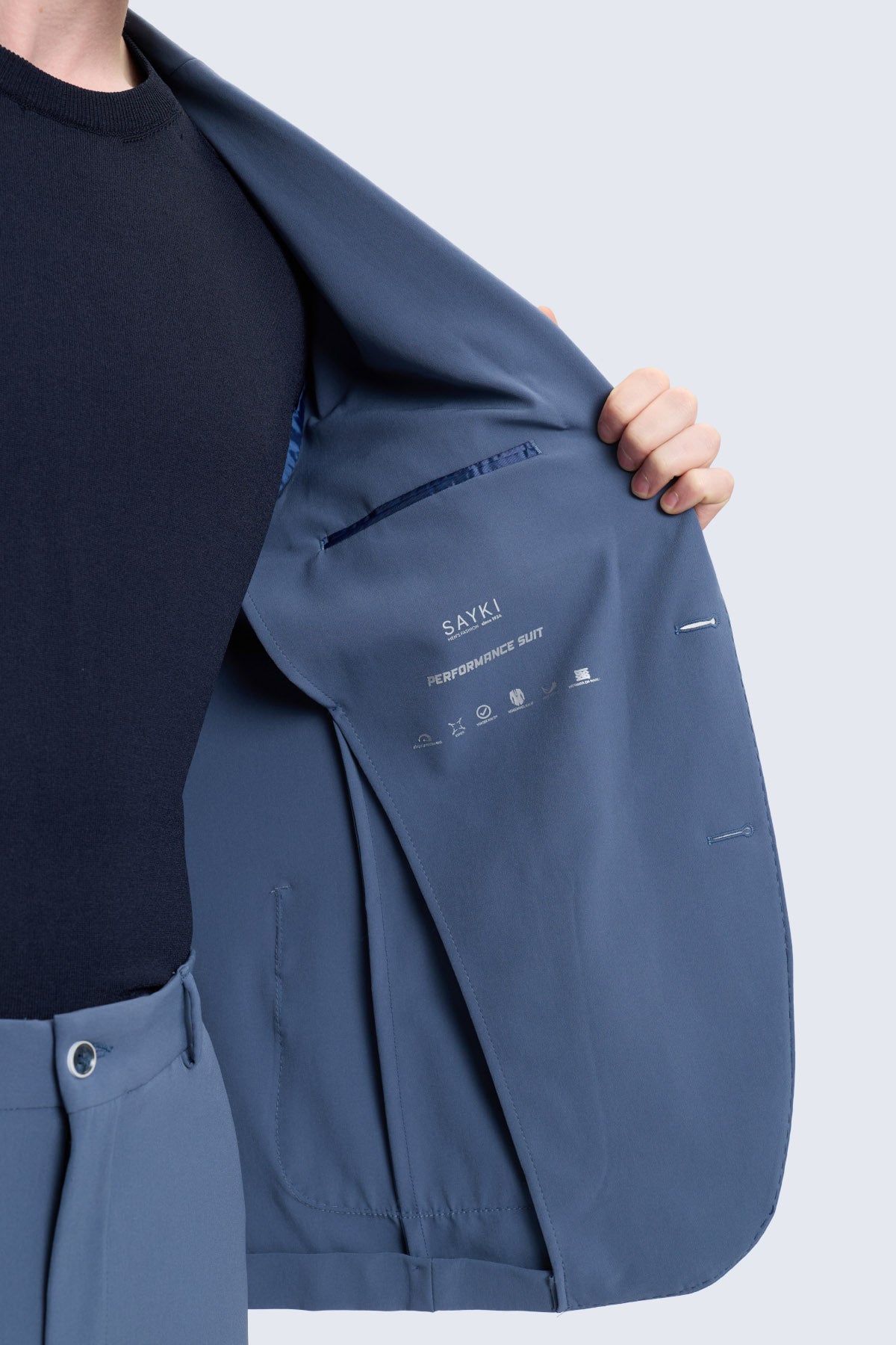 Navy blue sayki slim fit performance suit jacket with notch lapel and subtle stitching for smart casual wear