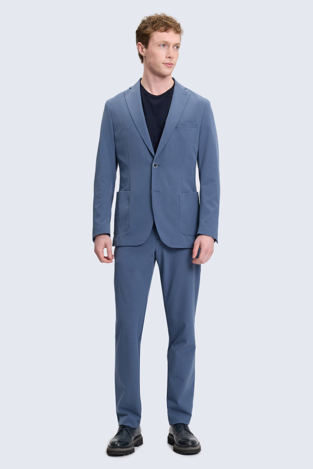 Slim fit blue casual suit with notch lapel single-breasted jacket and matching textured trousers for smart casual wear