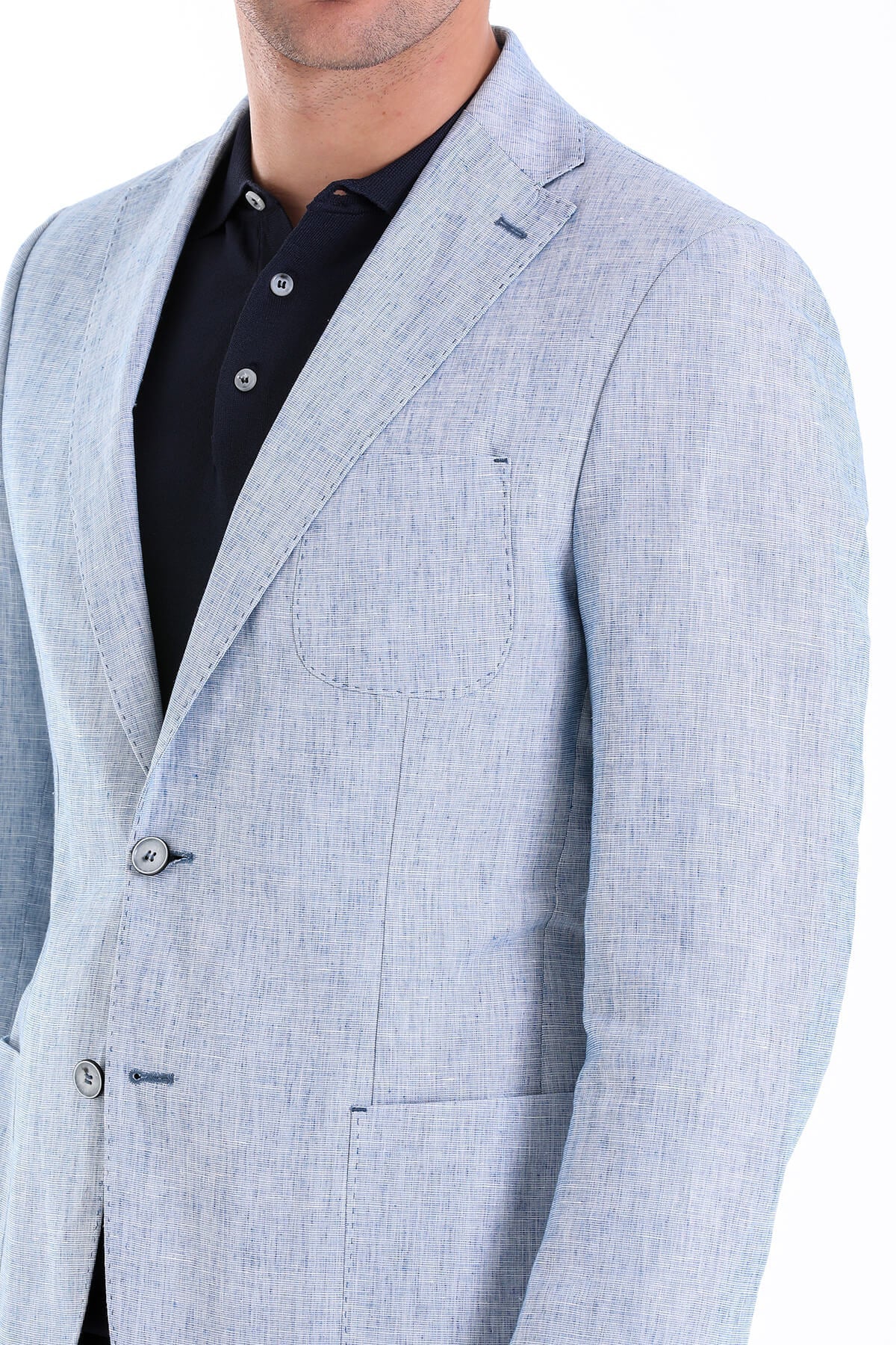 Light blue textured blazer with subtle weave pattern and matching button details.