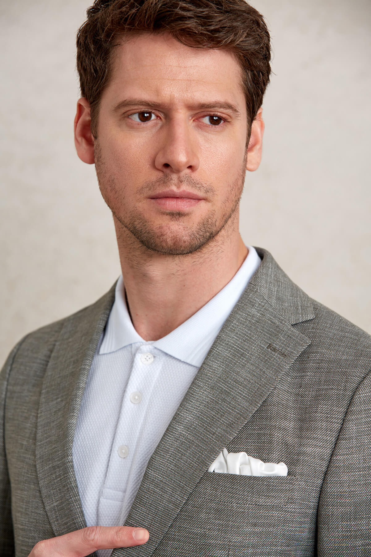 Gray textured blazer with a white pocket square