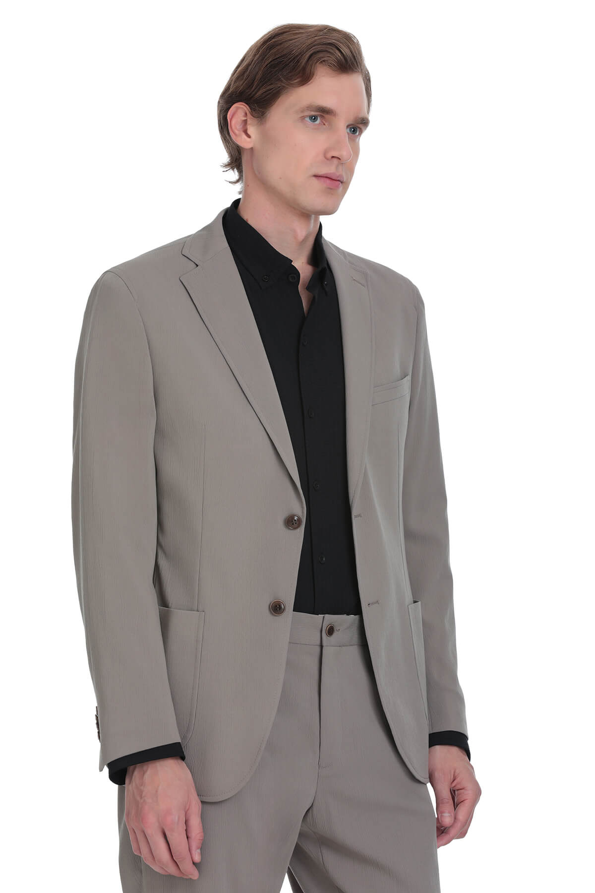 A tailored gray suit jacket with black inner lining and matching trousers.