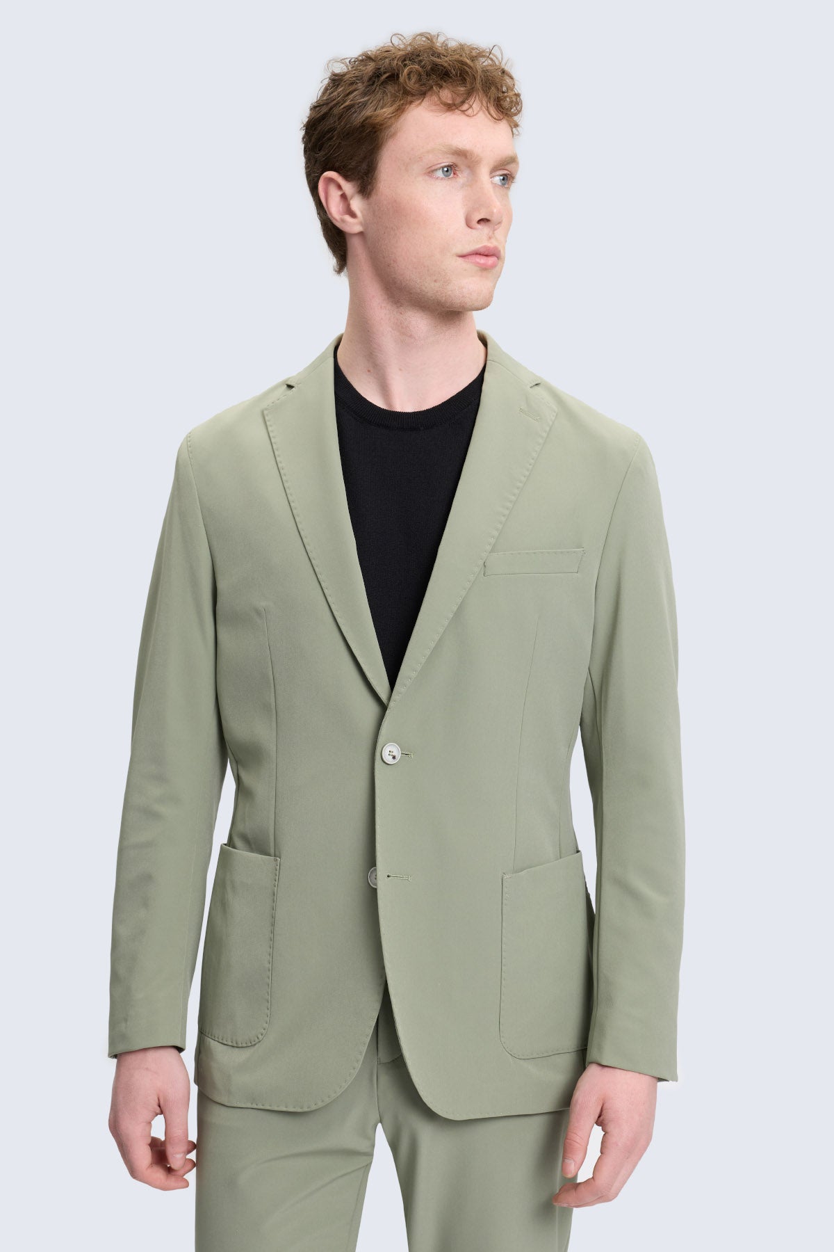 A slim fit sage green tailored blazer with notch lapel and two front flap pockets for casual wear