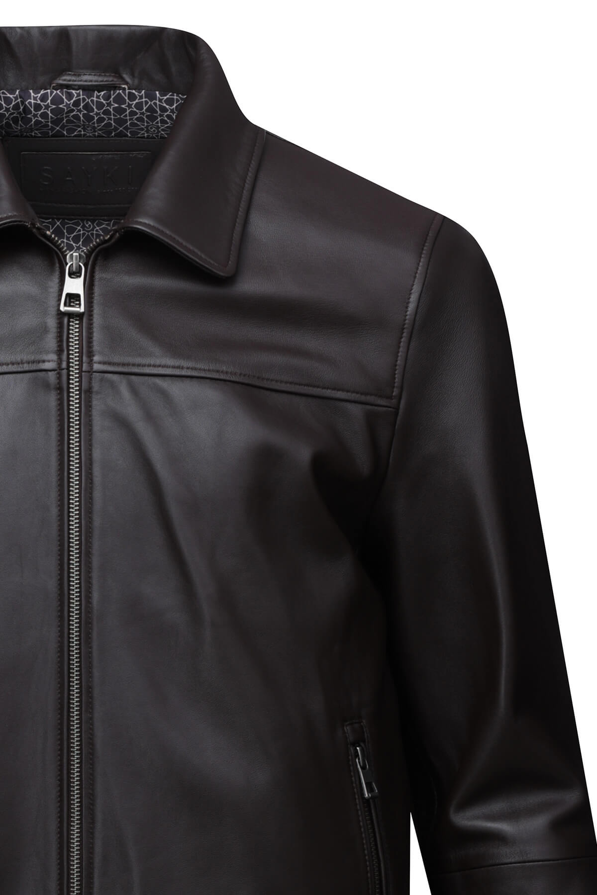 Black leather jacket with a subtle geometric pattern lining the collar and silver-toned zipper.