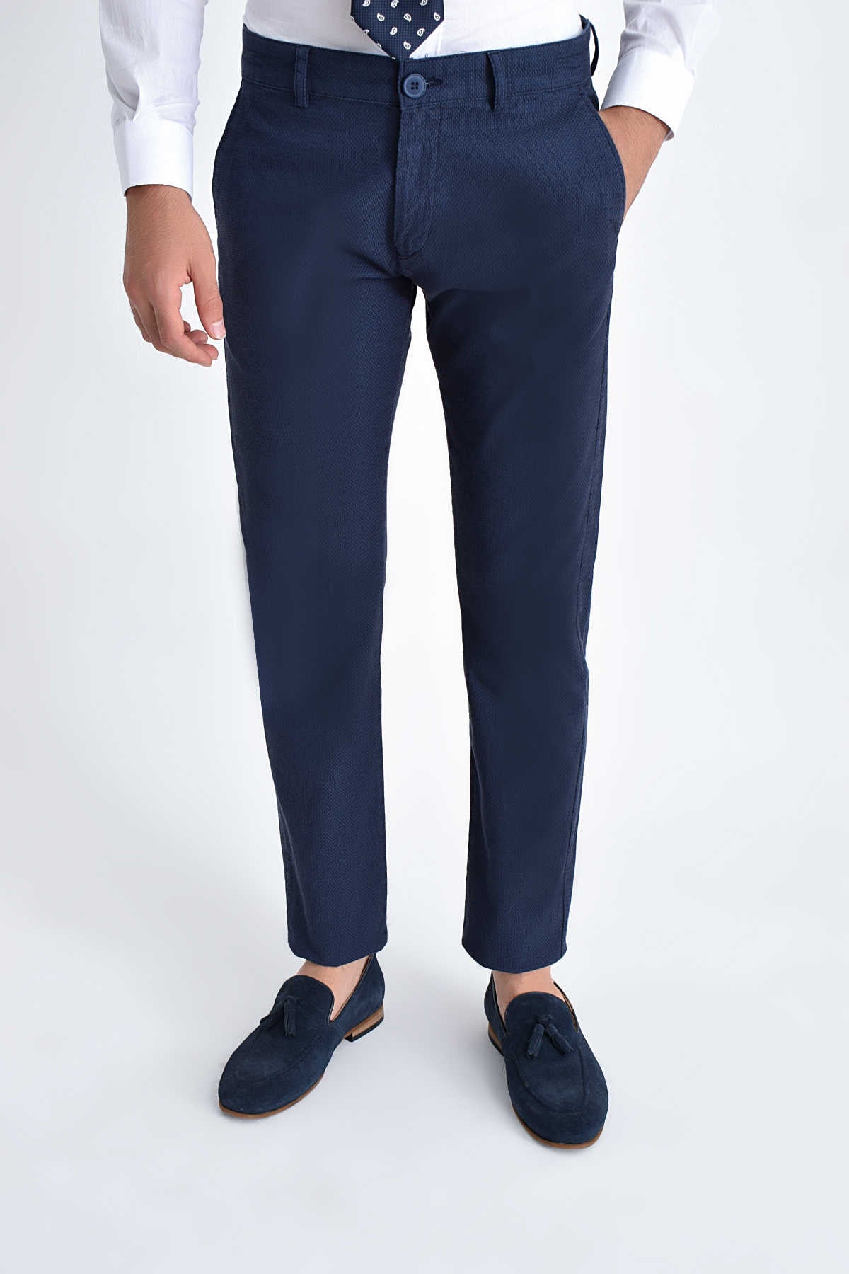 Navy blue slim-fit chinos with a subtle texture and matching button closure