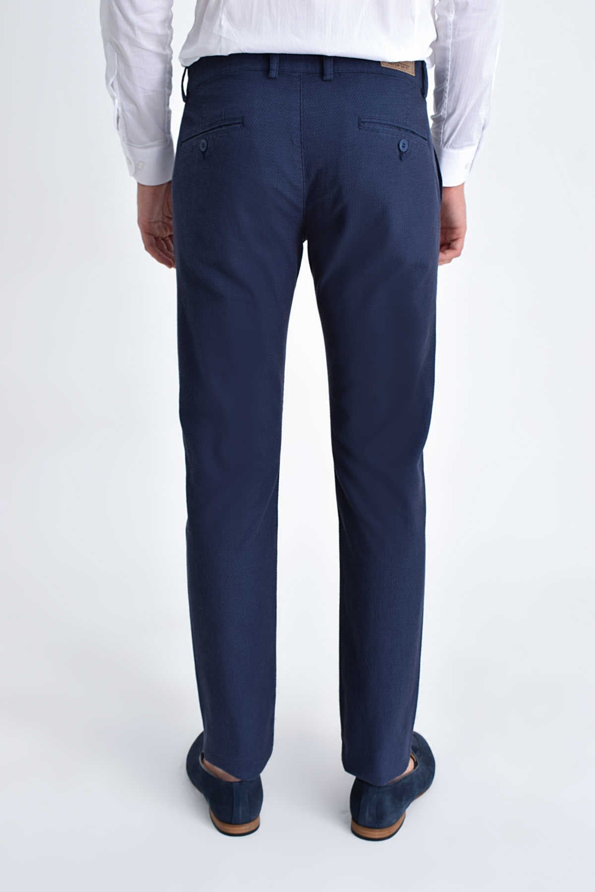 Navy blue tailored trousers with a sleek, straight-leg cut and subtle stitching details