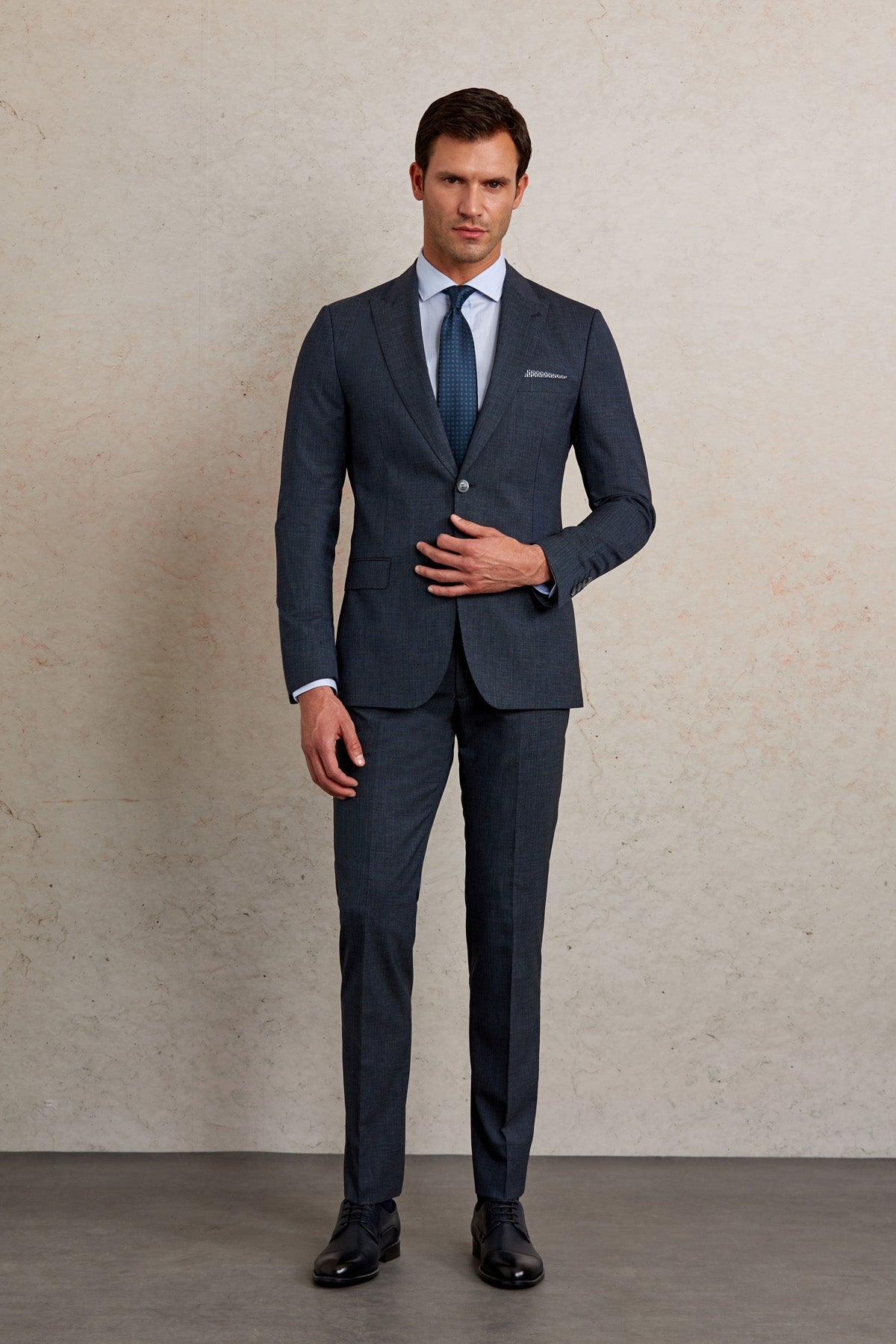 Dark navy two-piece suit with a tailored fit and subtle texture.