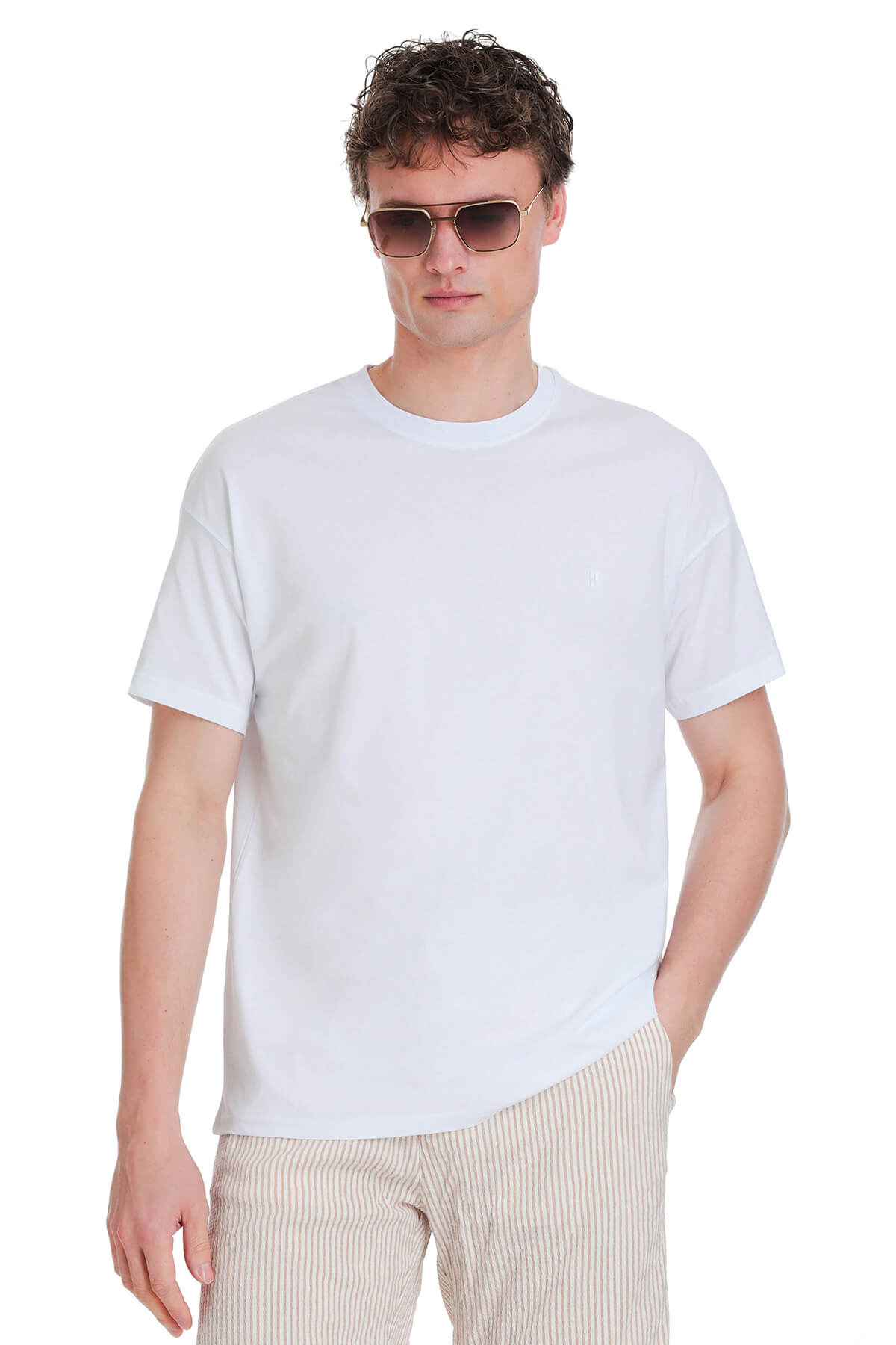 White oversize cotton crew neck t-shirt with subtle embroidered logo on the left chest