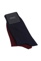 A pair of sayki men’s dress socks in navy blue and burgundy, neatly folded with a black branded tag.
