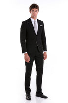 Black tailored suit with a sleek, modern cut and matching trousers.