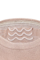 Beige knit sweater with white wavy pattern embroidered on chest paired with 5-pack no show bamboo socks