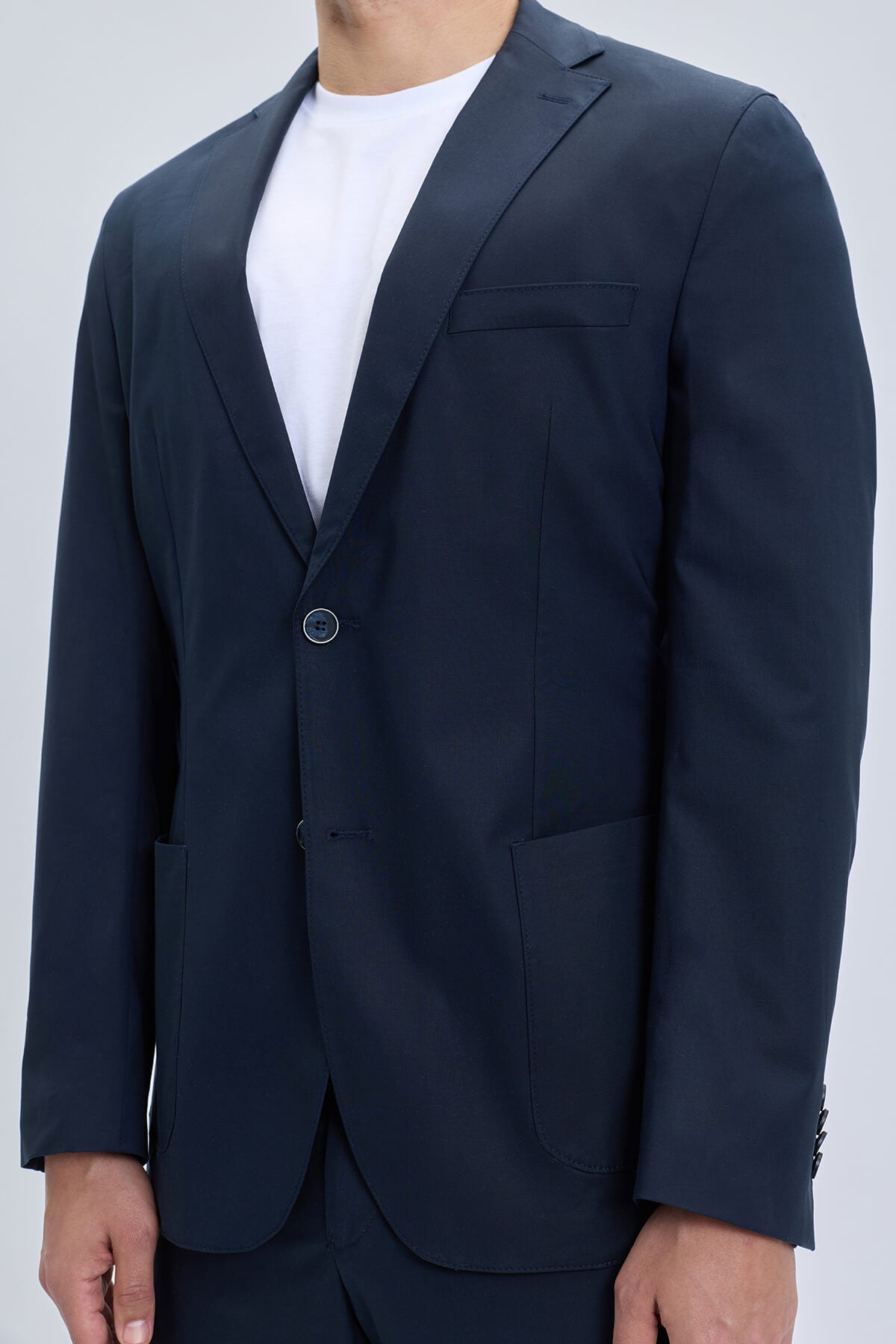 Navy slim fit notch lapel blazer with single button closure and structured lapels in lightweight casual suit