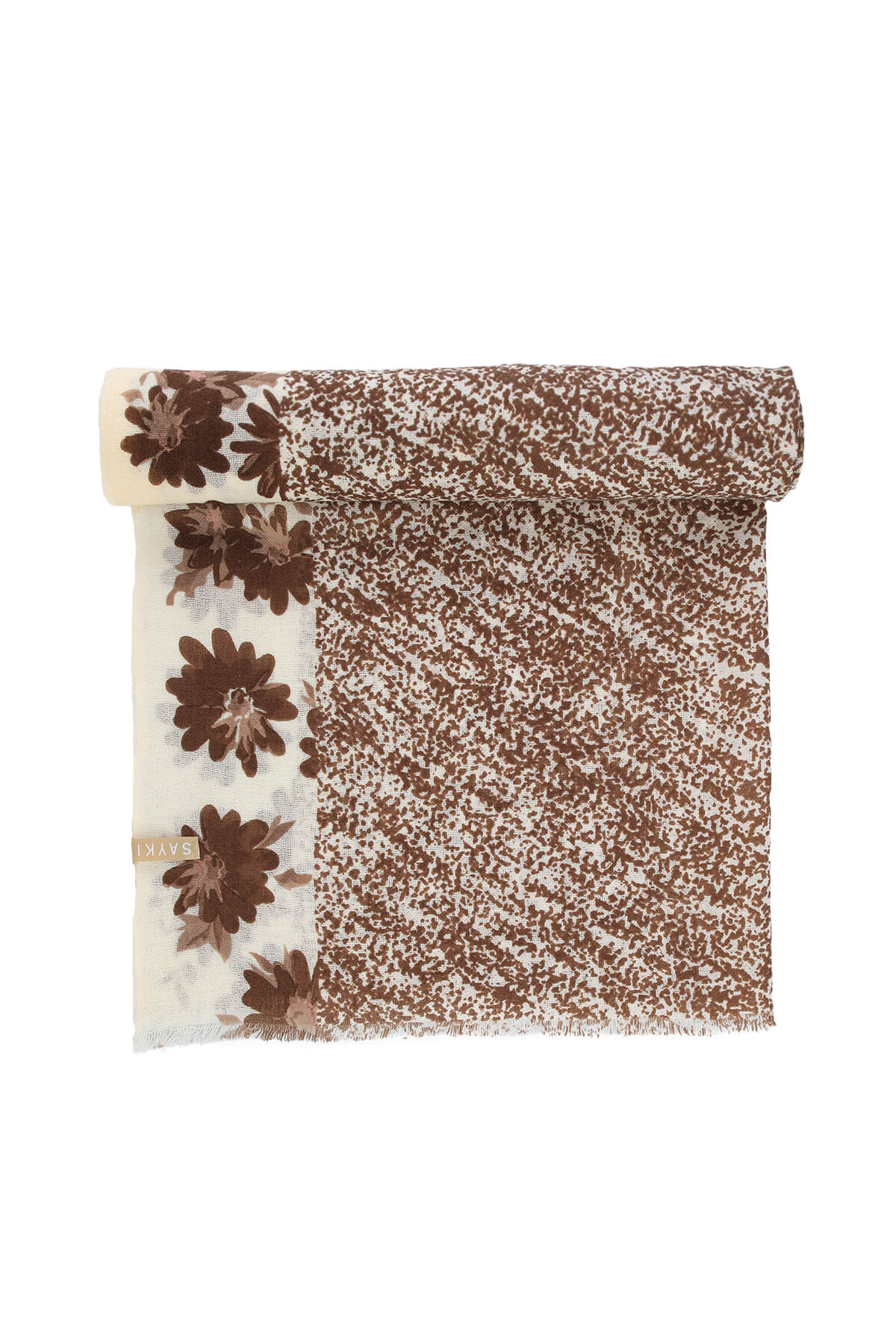 A cream-colored scarf with a brown floral pattern and speckled design, featuring frayed edges.