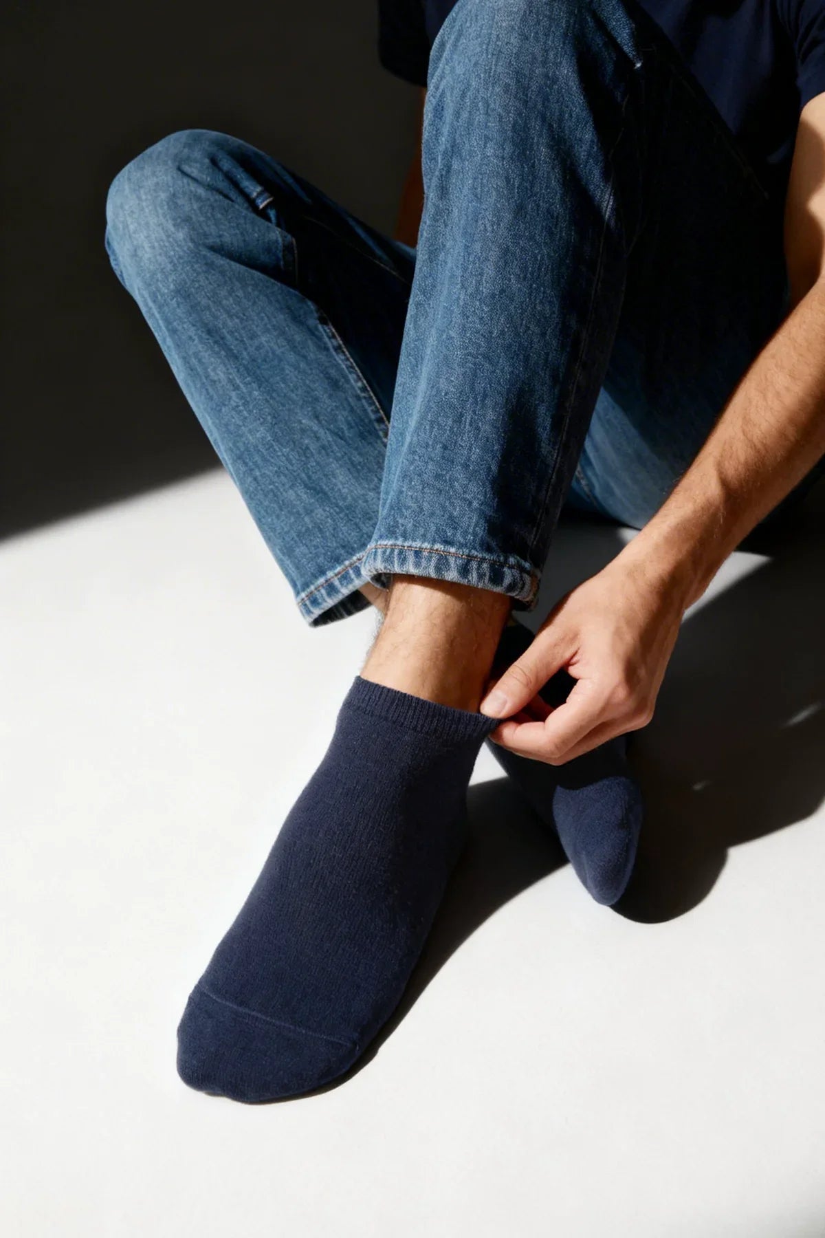 Dark navy bamboo breathable socks with ribbed cuff worn with blue jeans in gift box for everyday comfort