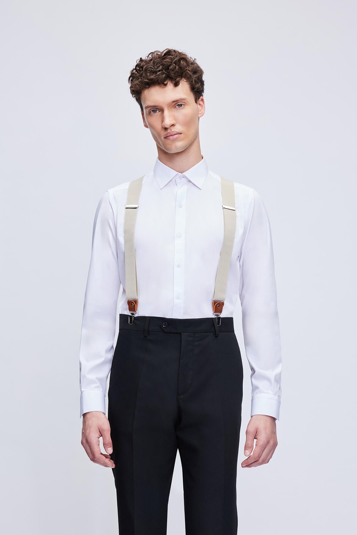 Beige fabric suspenders with brown leather trim clip clasps for stylish and durable wear