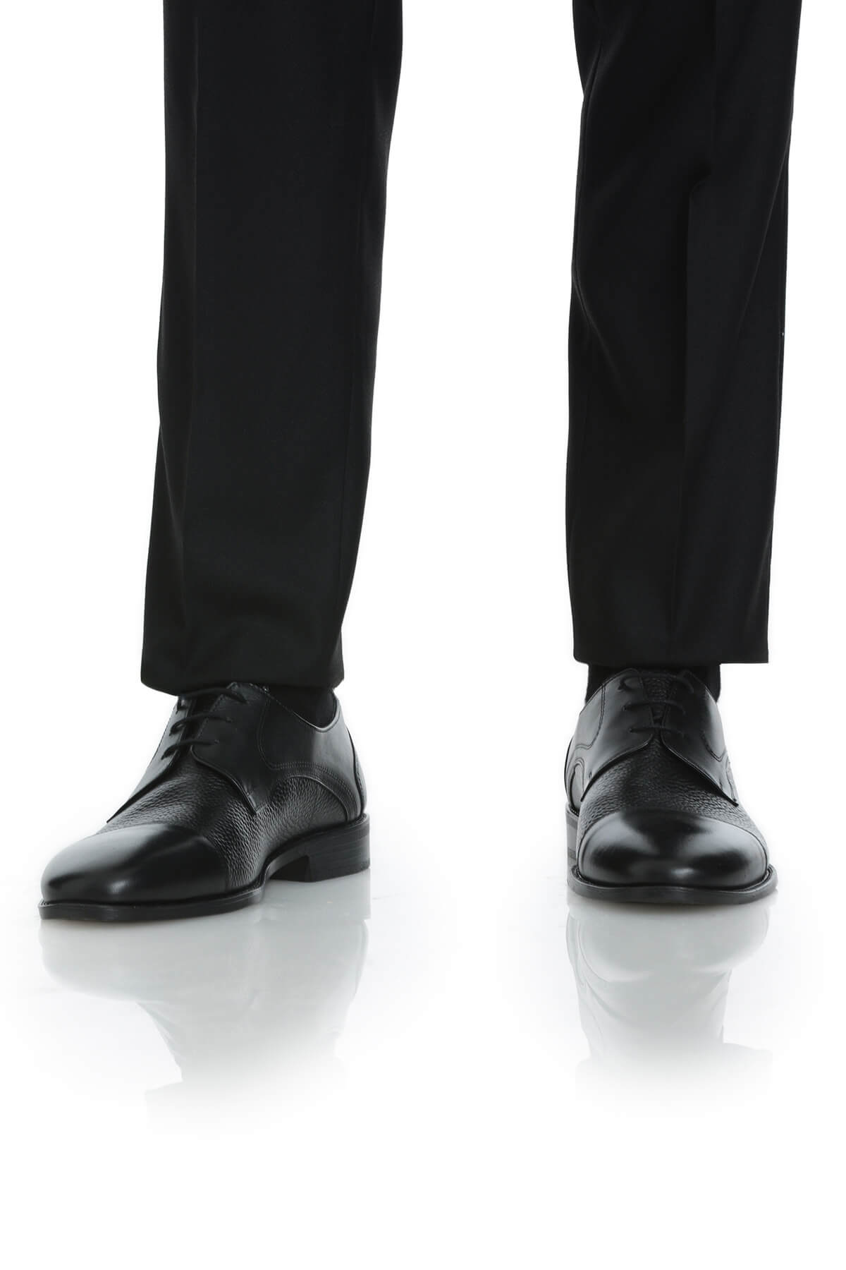 Black leather dress shoes with a subtle textured pattern and classic cap-toe design.