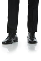 Black leather dress shoes with a subtle textured pattern and classic cap-toe design.