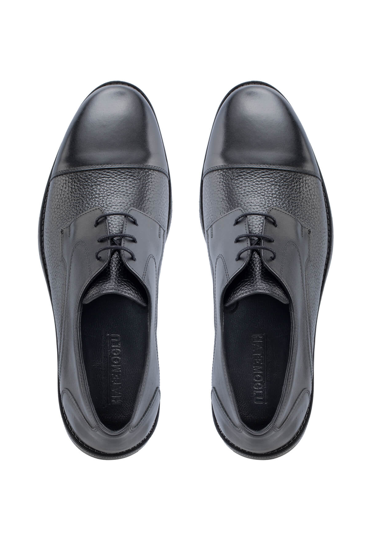 Black leather oxford shoes with a glossy toe cap and textured side panels.