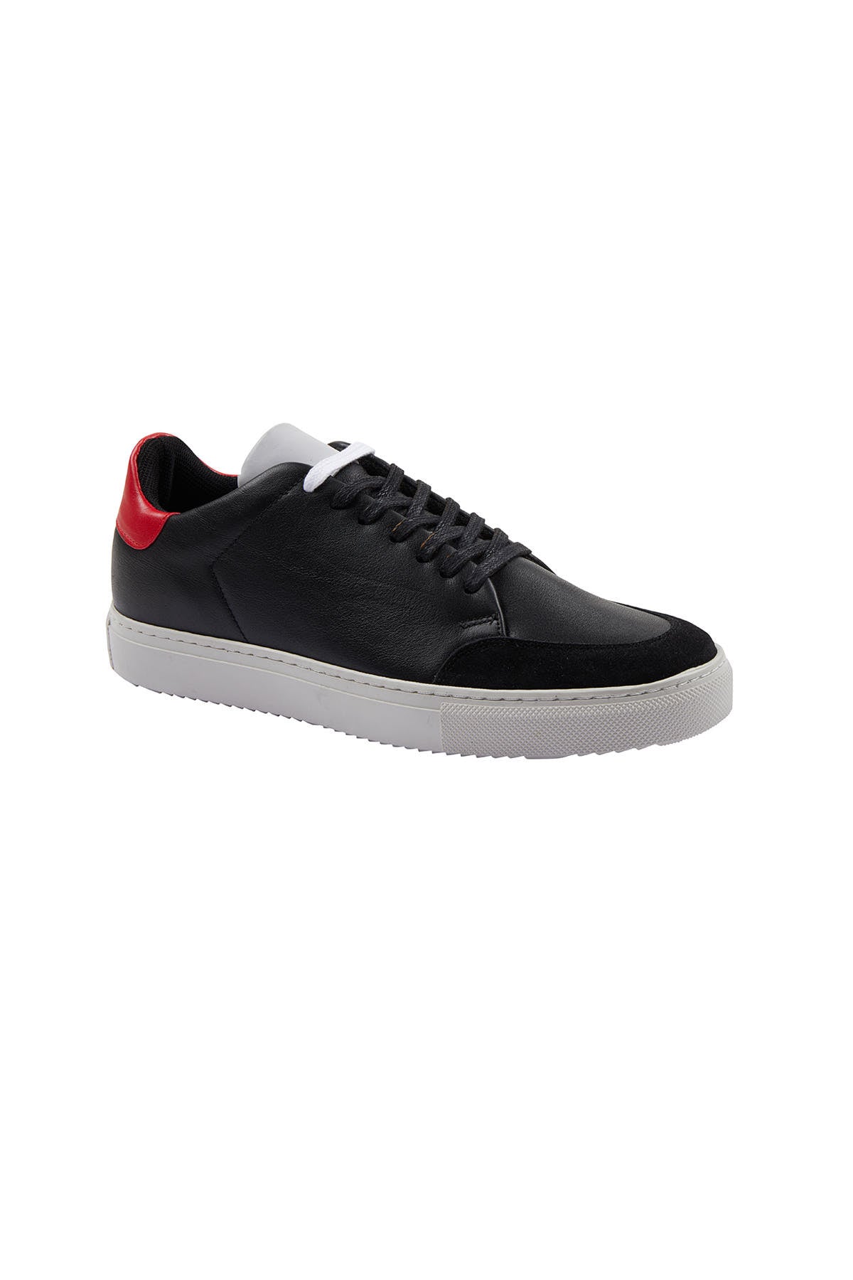 Black leather sneaker with a red heel tab and white laces, featuring a contrasting suede toe cap and a chunky white rubber sole.