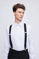 Black leather trim clip suspenders with black straps and silver-toned metal clasps and adjustable buckles