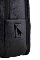 Black textured leather backpack with a built-in usb charging port.