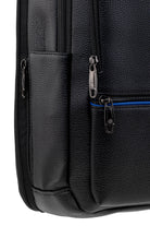Black textured leather backpack with silver zippers and a blue zipper lining.