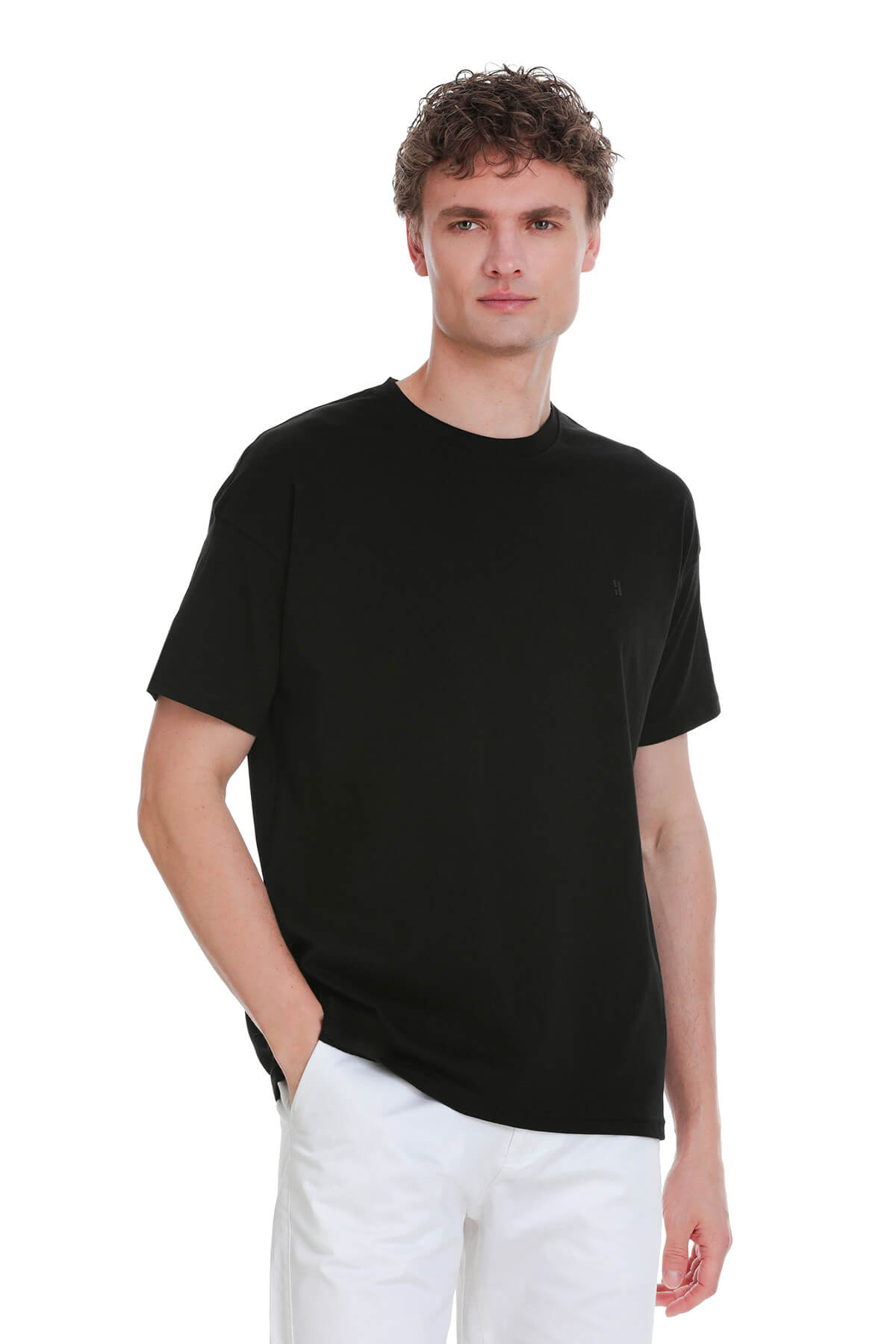 Black oversize crew neck t-shirt with short sleeves and subtle embroidered logo on the left chest