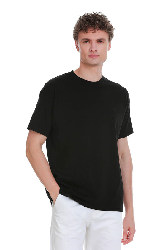 Black oversize crew neck t-shirt with short sleeves and subtle embroidered logo on the left chest